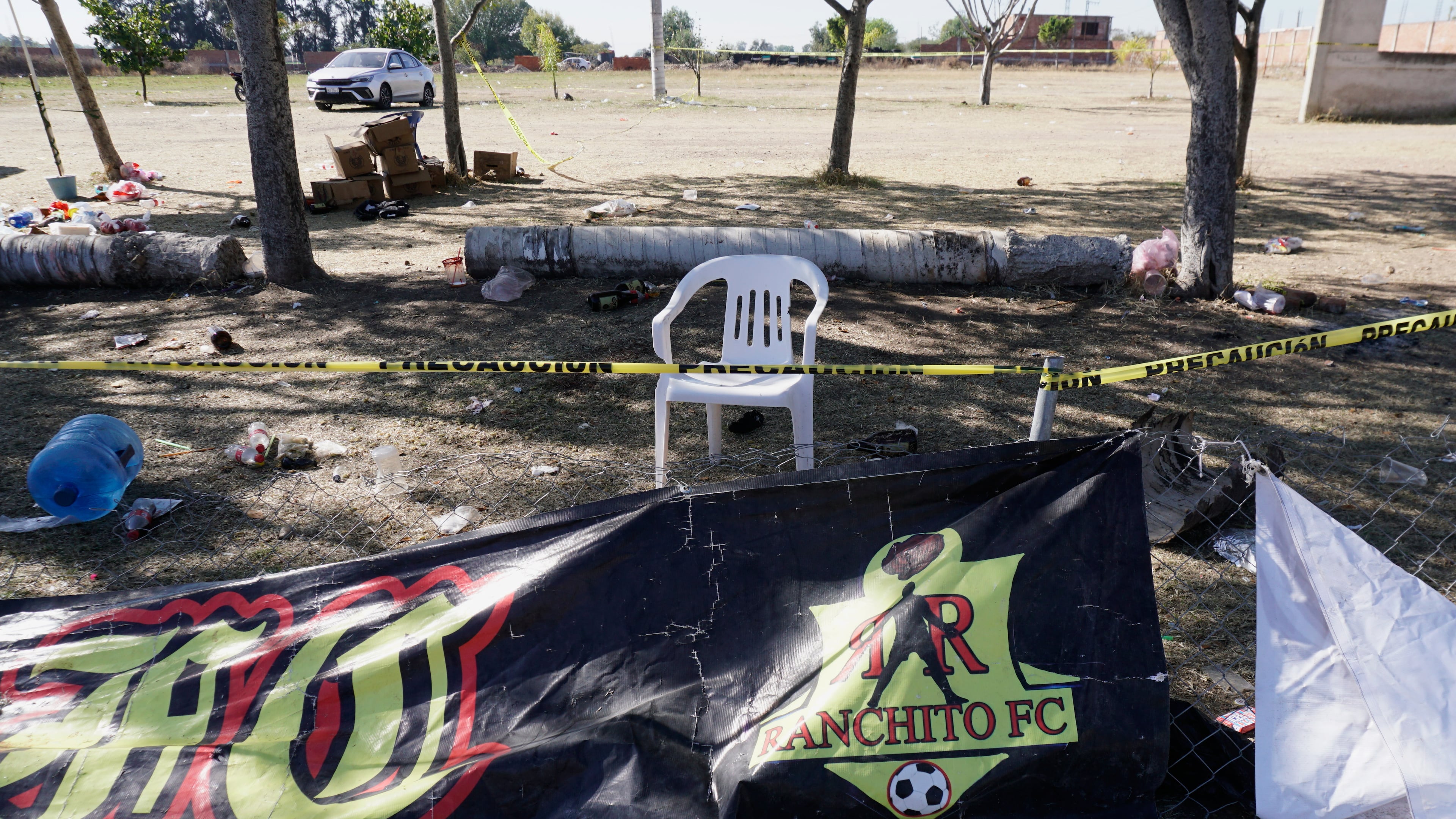 Crime scene tape surrounds a soccer field the day after gunmen opened fire, killing and wounding people, in Salamanca, Mexico, Monday, Jan. 26, 2026. (AP Photo/Mario Armas)