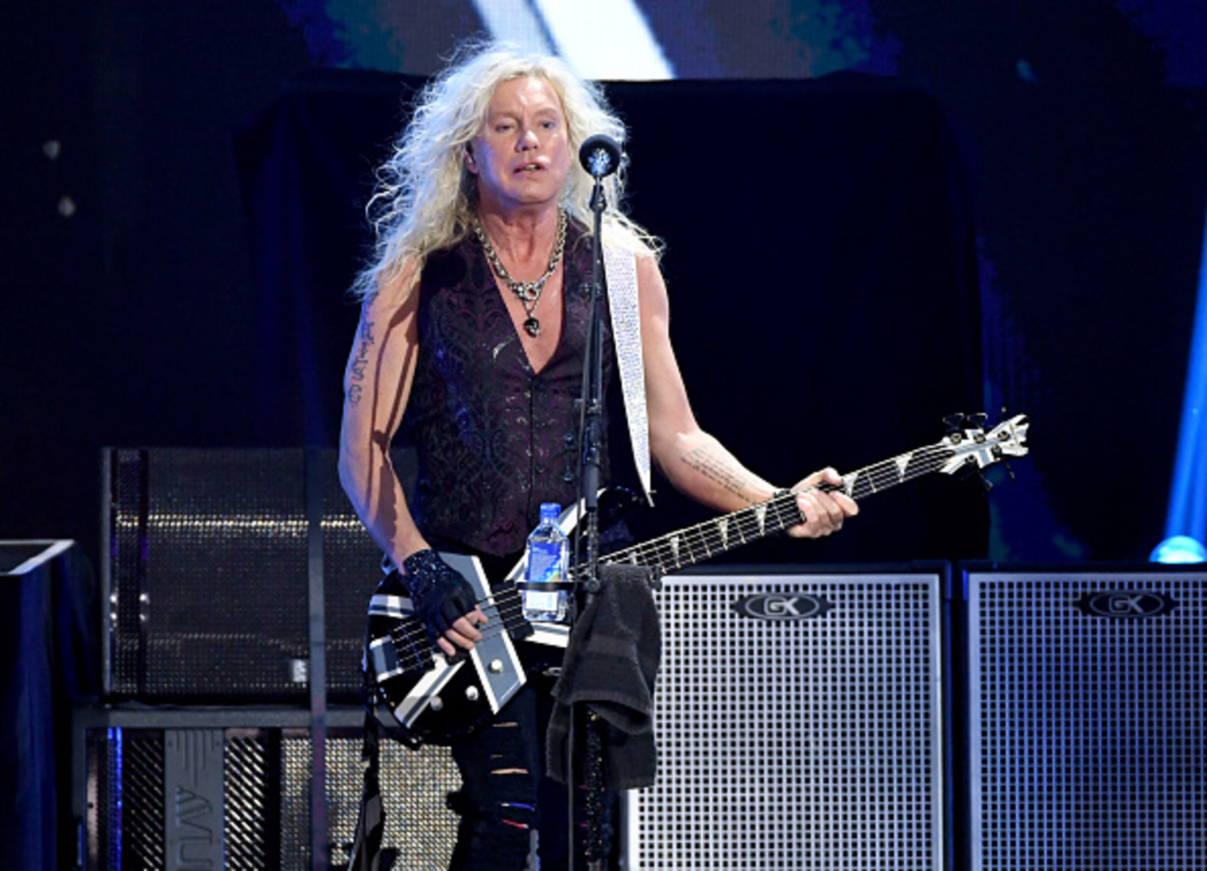 LAS VEGAS, NEVADA - SEPTEMBER 21: (EDITORIAL USE ONLY) Rick Savage of Def Leppard performs onstage during the 2019 iHeartRadio Music Festival at T-Mobile Arena on September 21, 2019 in Las Vegas, Nevada. (Photo by Kevin Winter/Getty Images for iHeartMedia)