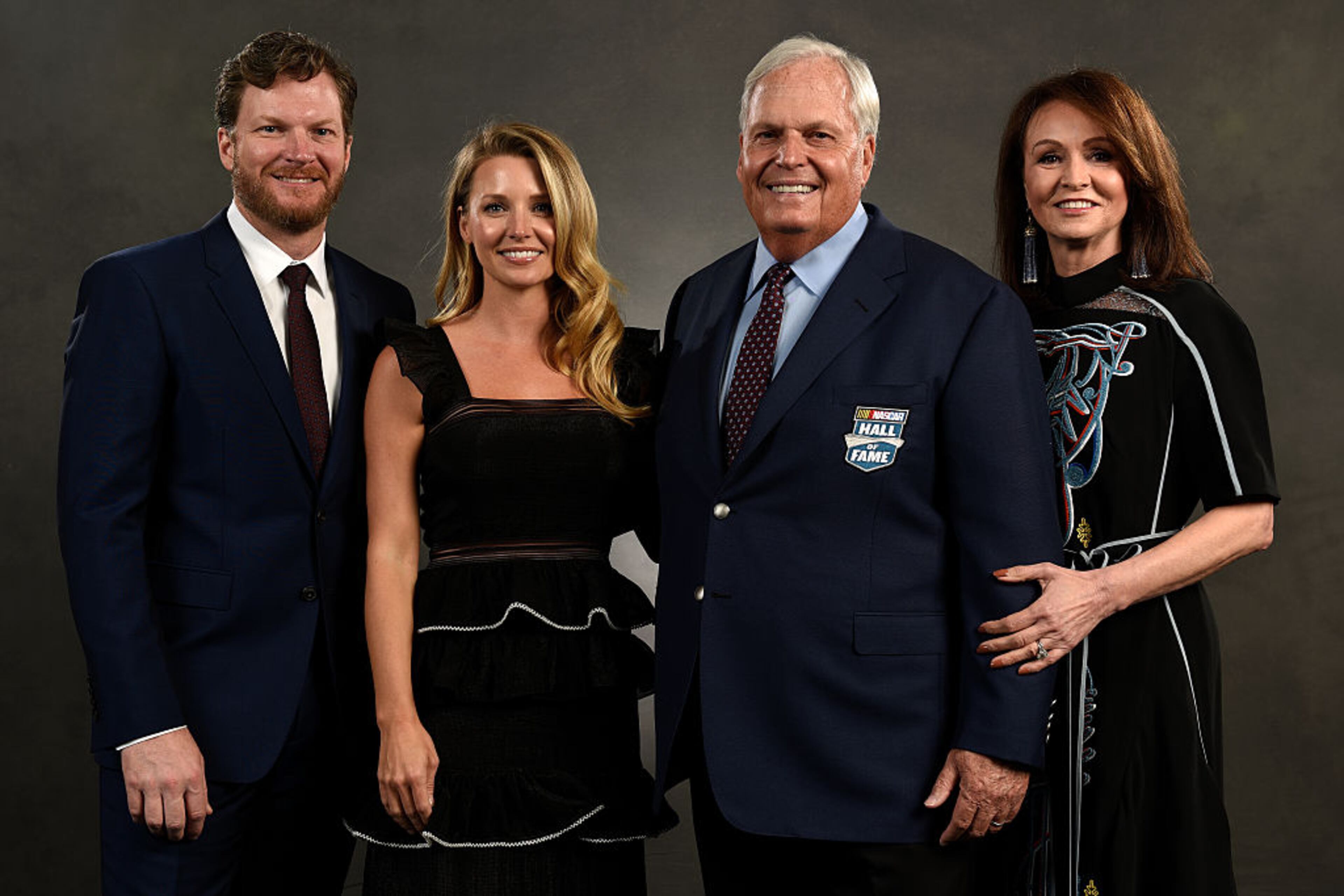 CHARLOTTE, NC - JANUARY 20: NASCAR driver Dale Earnhardt Jr. and his wife Amy pose with NASCAR Hall of Fame inductee Rick Hendrick and his wife Linda after the NASCAR Hall of Fame Class of 2017 Induction Ceremony at NASCAR Hall of Fame on January 20, 2017 in Charlotte, North Carolina. (Photo by Jared C. Tilton/Getty Images)