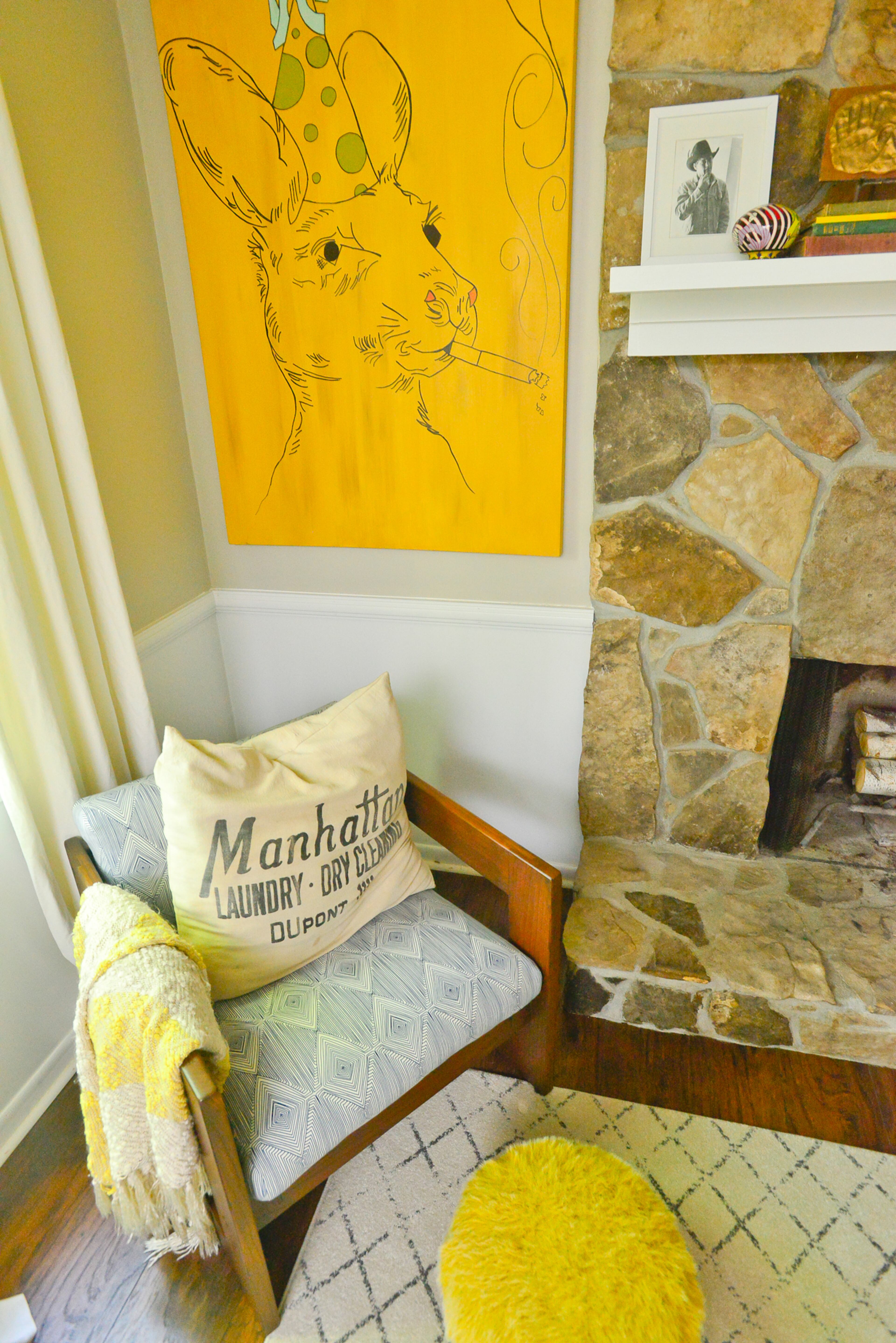 Living room: The kangaroo "Party Animal" artwork is an original by homeowner Dena Stormer and reintroduces the mustard color that Dena says has made it into every room of their Roswell home.