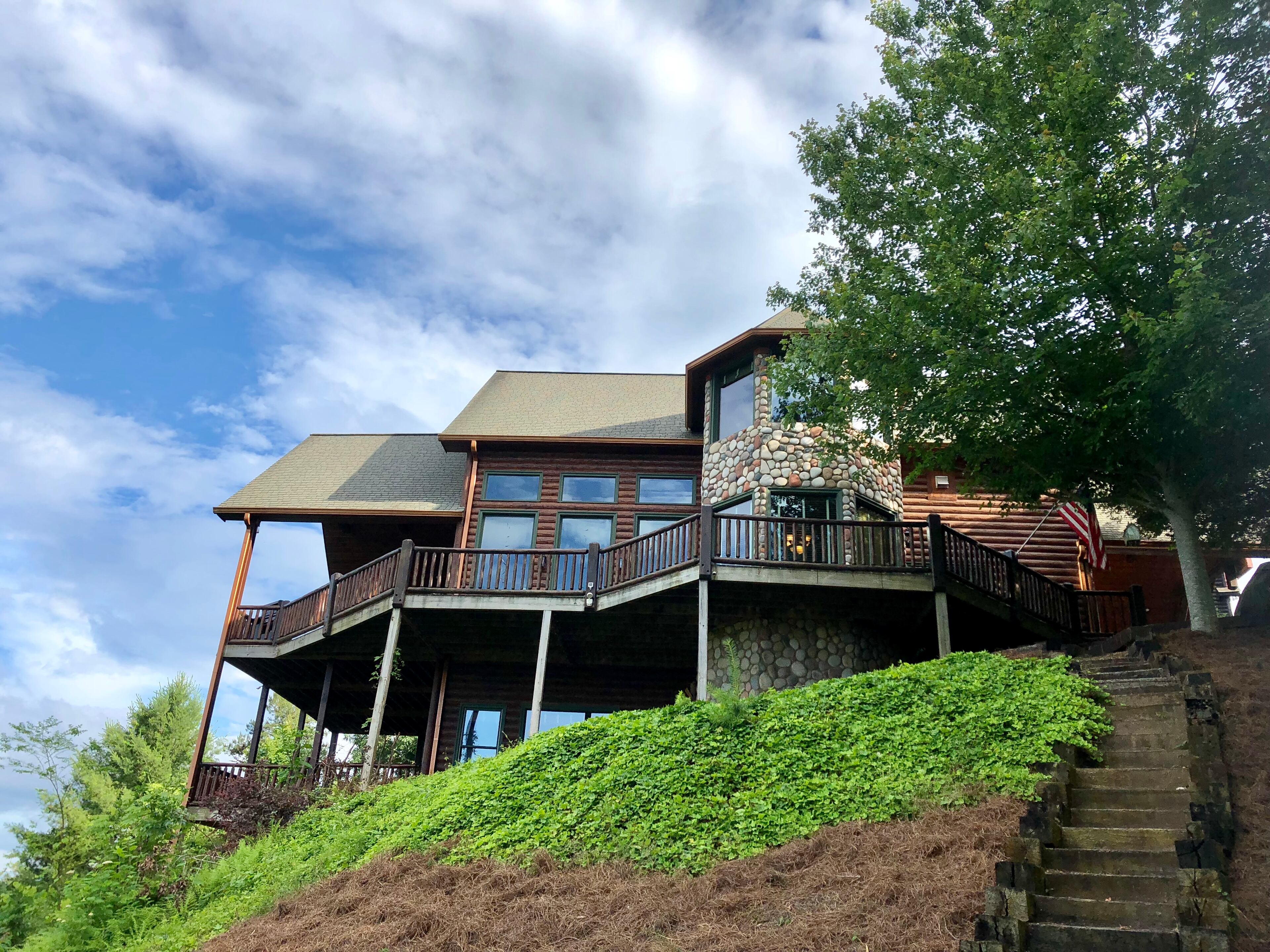 From an upwards glance across the foothills of Blue Ridge, the 3,600 square-foot What If Cabin is a beckoning sight.