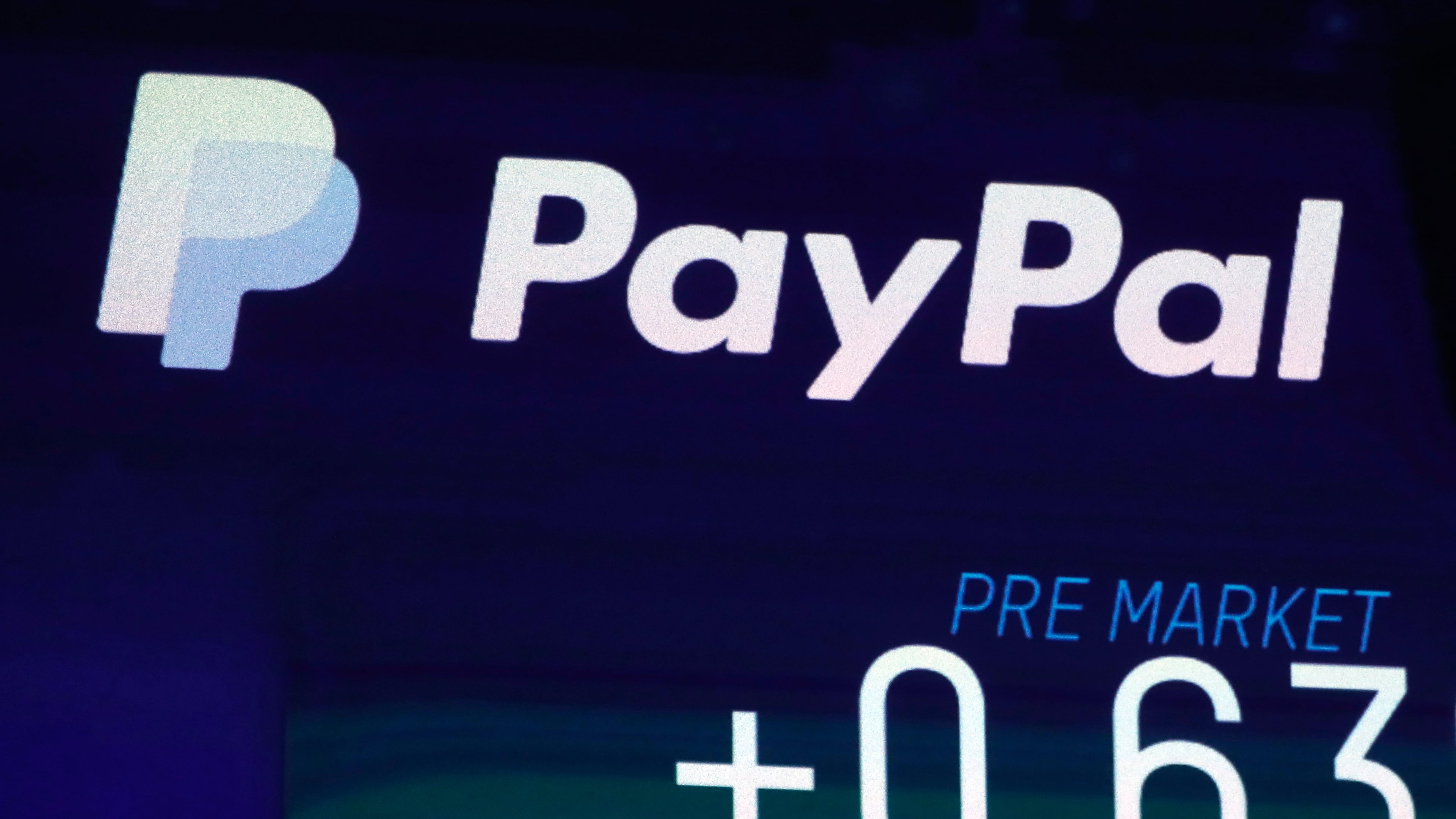FILE - ,The PayPal logo appears on a screen at the Nasdaq MarketSite, on Oct. 3, 2018 in New York. PayPal reports earning on Tuesday, July 30, 2024. (AP Photo/Richard Drew, File)