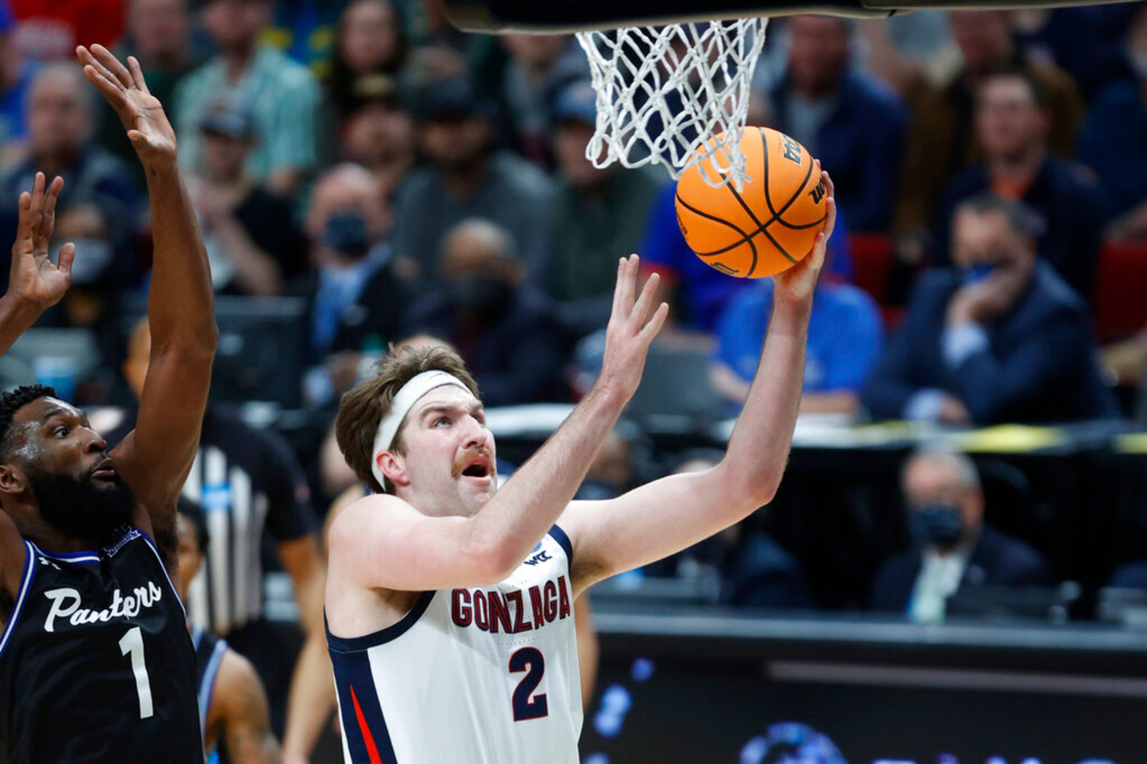 Gonzaga forward Drew Timme (2) puts up a shot in front of Georgia State forward Eliel Nsoseme (1) during the first half of a first round NCAA college basketball tournament game, Thursday, March 17, 2022, in Portland, Ore. (AP Photo/Craig Mitchelldyer)