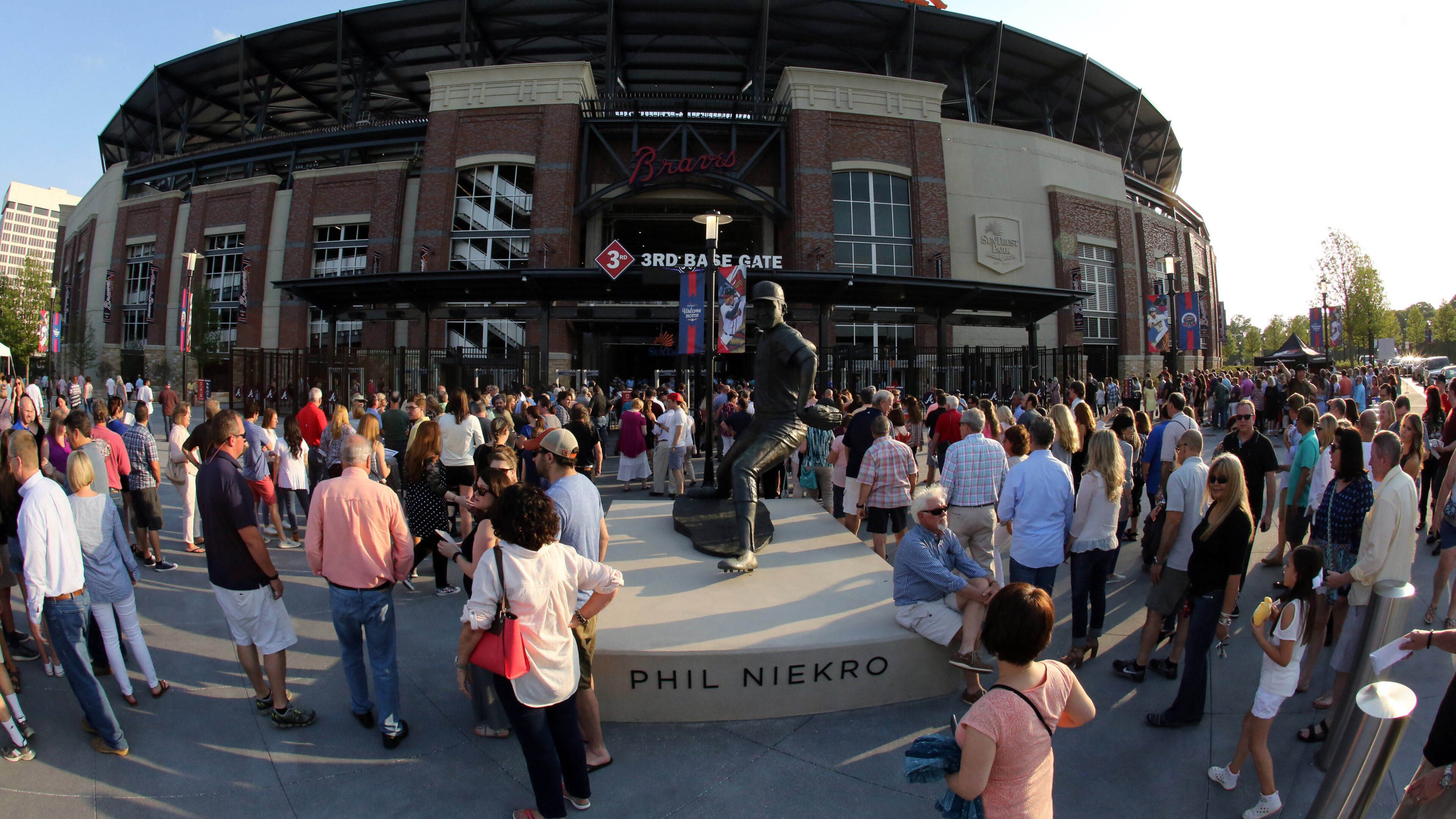 Fans wait to get inside SunTrust Park Friday night for Billy Joel, the first concert held at the baseball stadium. Photo: Robb Cohen Photography & Video