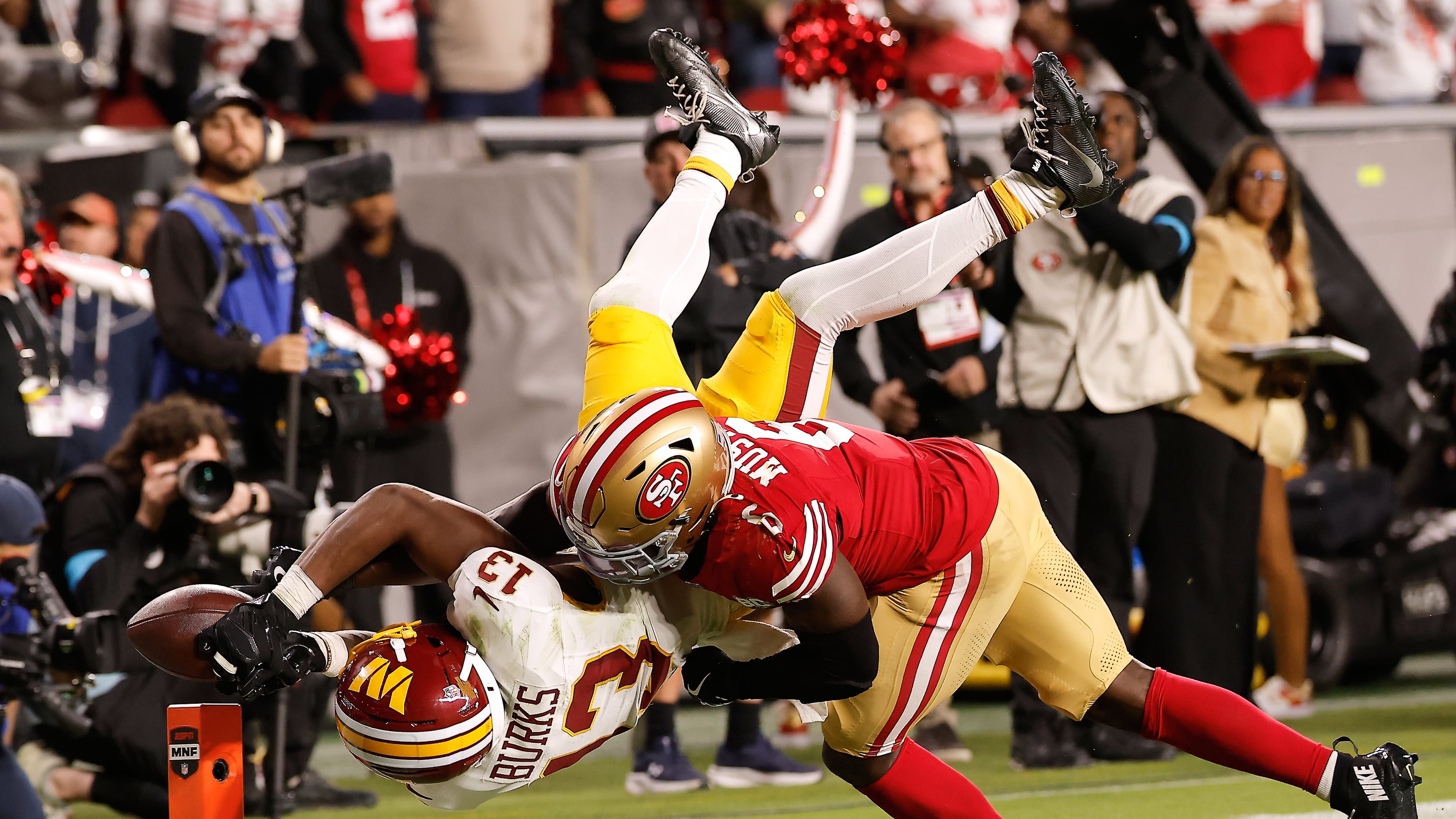 Washington Commanders wide receiver Treylon Burks (13) cannot catch a pass while being defended by San Francisco 49ers safety Malik Mustapha (6) during the second half of an NFL football game in Santa Clara, Calif., Monday, Oct. 19, 2026. (AP Photo/Kelley L. Cox)