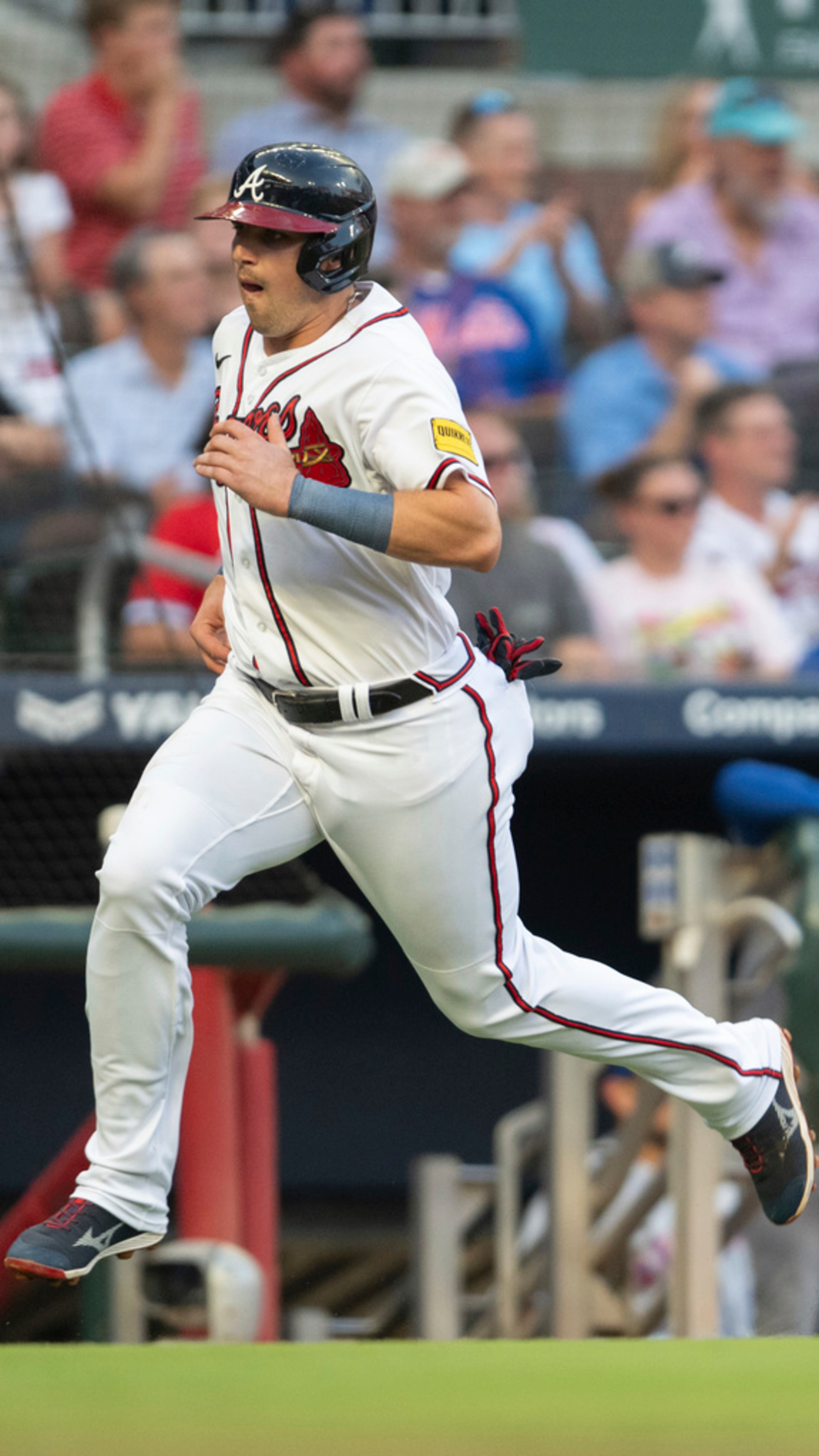 Atlanta Braves' Austin Riley heads home to score against the New York Mets during the first inning of a baseball game Wednesday, Aug. 23, 2023, in Atlanta. (AP Photo/Hakim Wright Sr.)