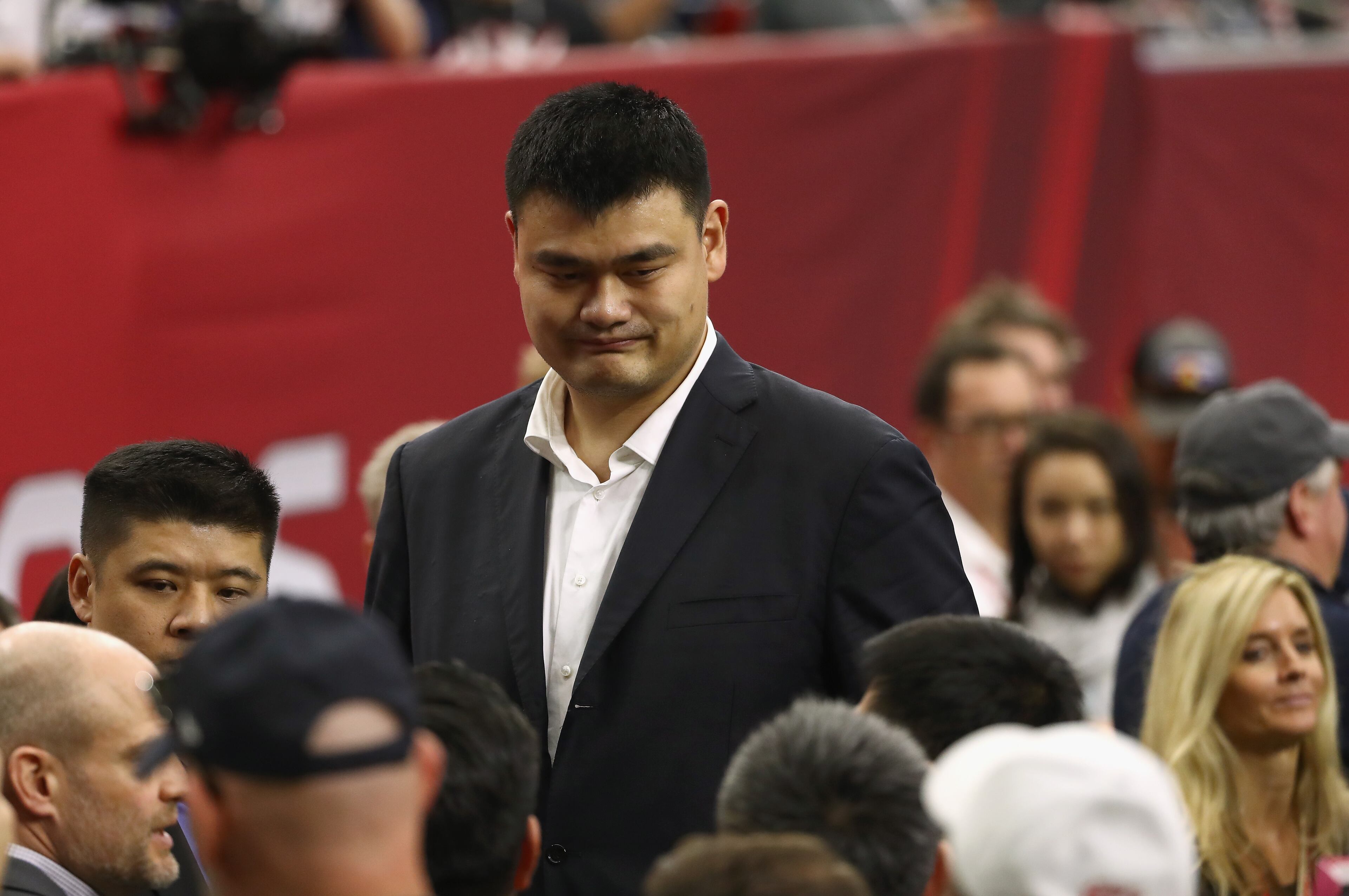 HOUSTON, TX - FEBRUARY 05: Former Houston Rocket and NBA Hall of Famer Yao Ming walks on the sideline before Super Bowl 51 between the Atlanta Falcons and the New England Patriots at NRG Stadium on February 5, 2017 in Houston, Texas. (Photo by Elsa/Getty Images)