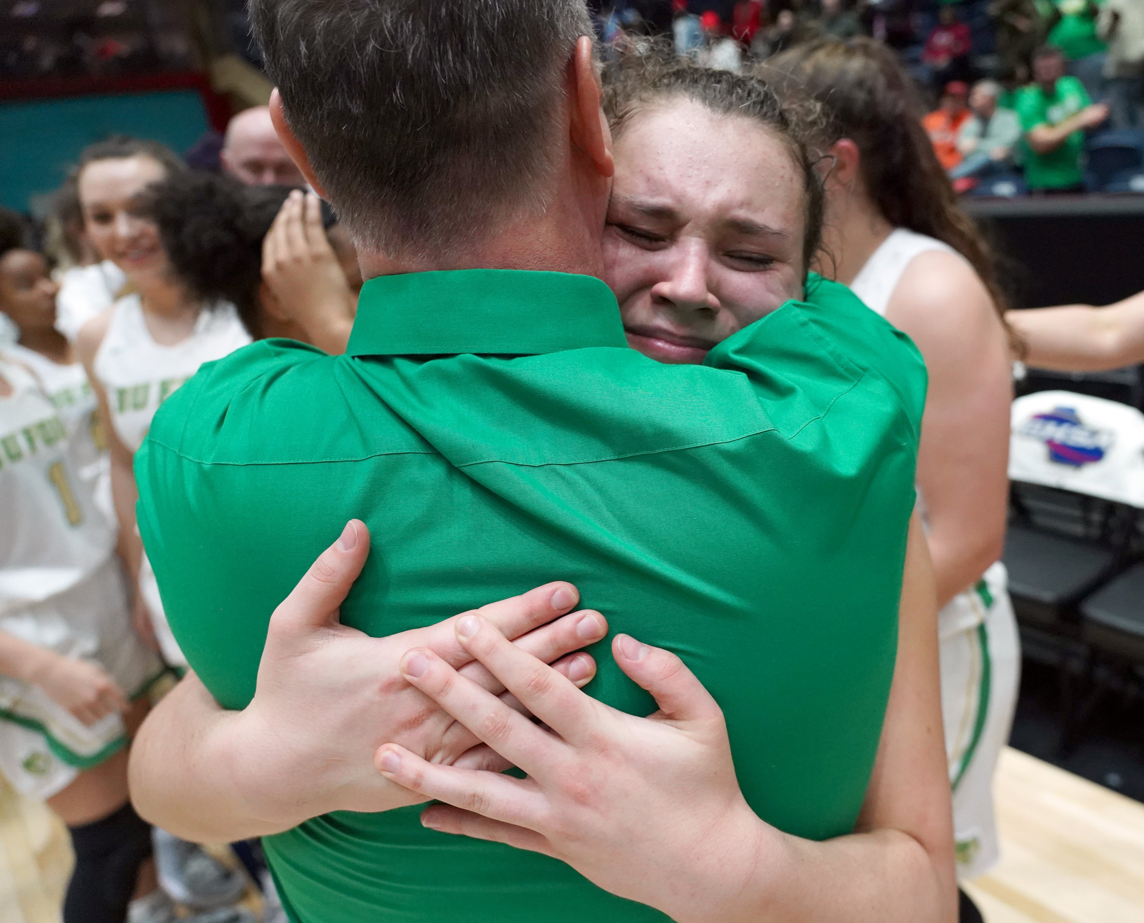 Buford's Katelyn Klein (right) hugs her coach Gene Durden as they celebrate their win over Kell at the Class AAAA girls title basketball game at the Macon Centreplex, Friday March 6, 2020, in Macon. Tami Chappell for the Atlanta Journal Constitution