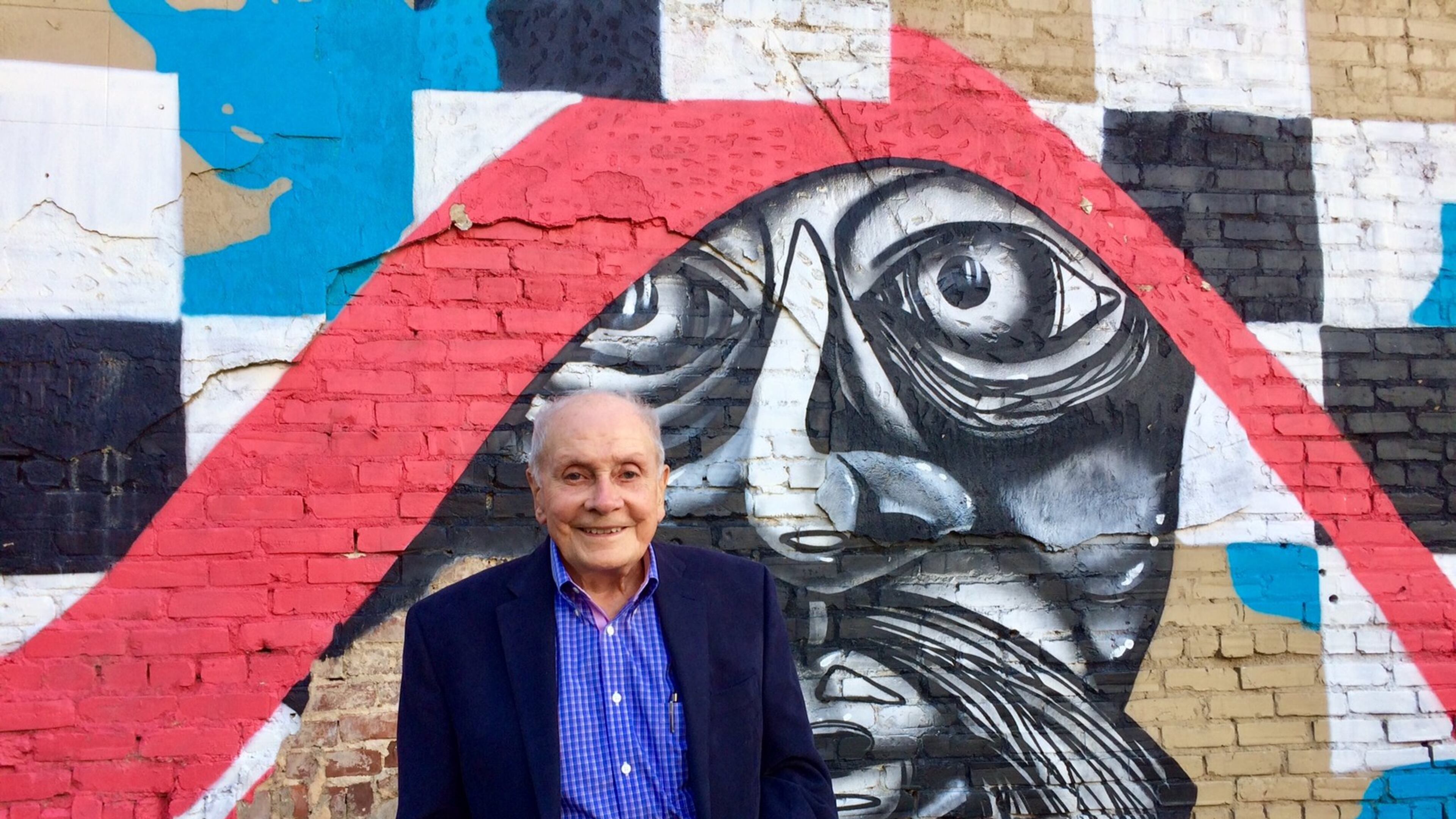 Morris Habif, 91, next to one of the buildings on Pryor Street he once owned.