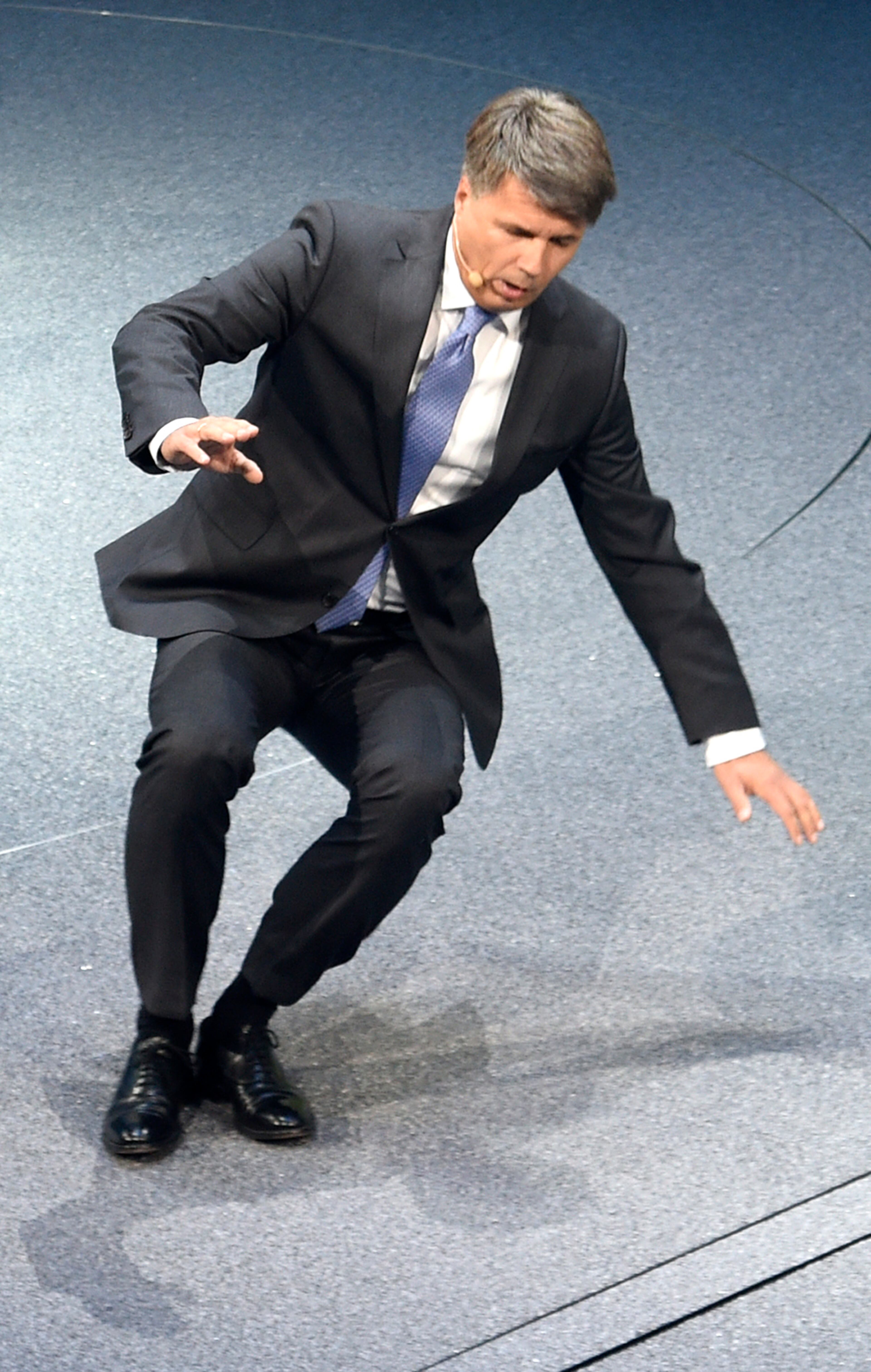 BMW CEO Harald Krueger collapses during the BMW presentation on the first press day of the Frankfurt Auto Show IAA in Frankfurt, Germany, Tuesday, Sept. 15, 2015. The car show runs through Sept. 27. (AP Photo/Jens Meyer)