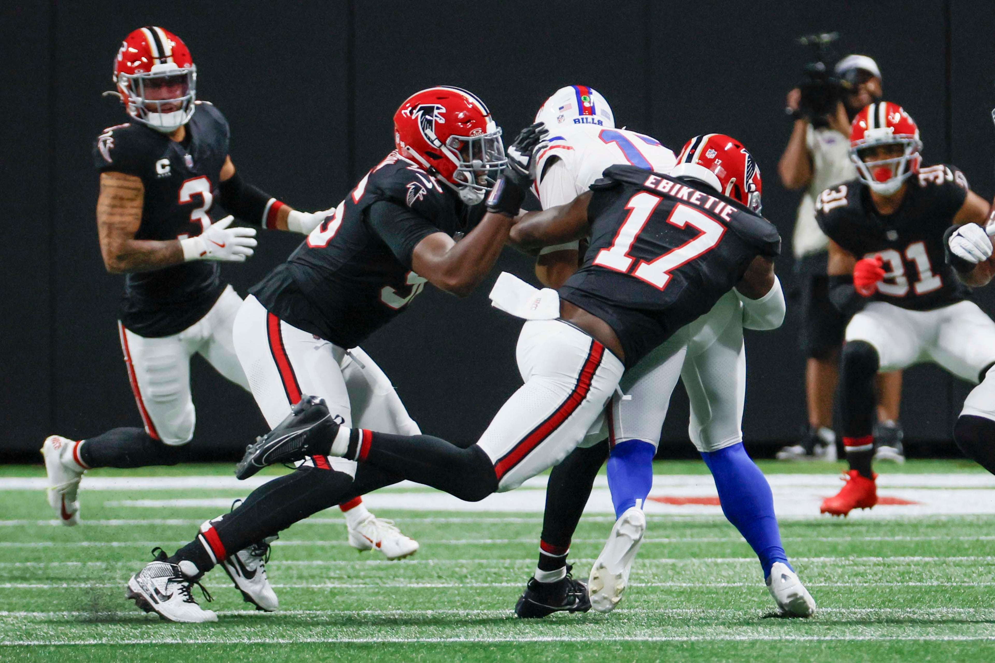 Atlanta Falcons linebacker Arnold Ebiketie (17) grabs Buffalo Bills quarterback Josh Allen (17) for a sack during the first half of an NFL football game against the Buffalo Bills at Mercedes-Benz Stadium in Atlanta on Monday, October 13, 2025.
(Miguel Martinez/ AJC)