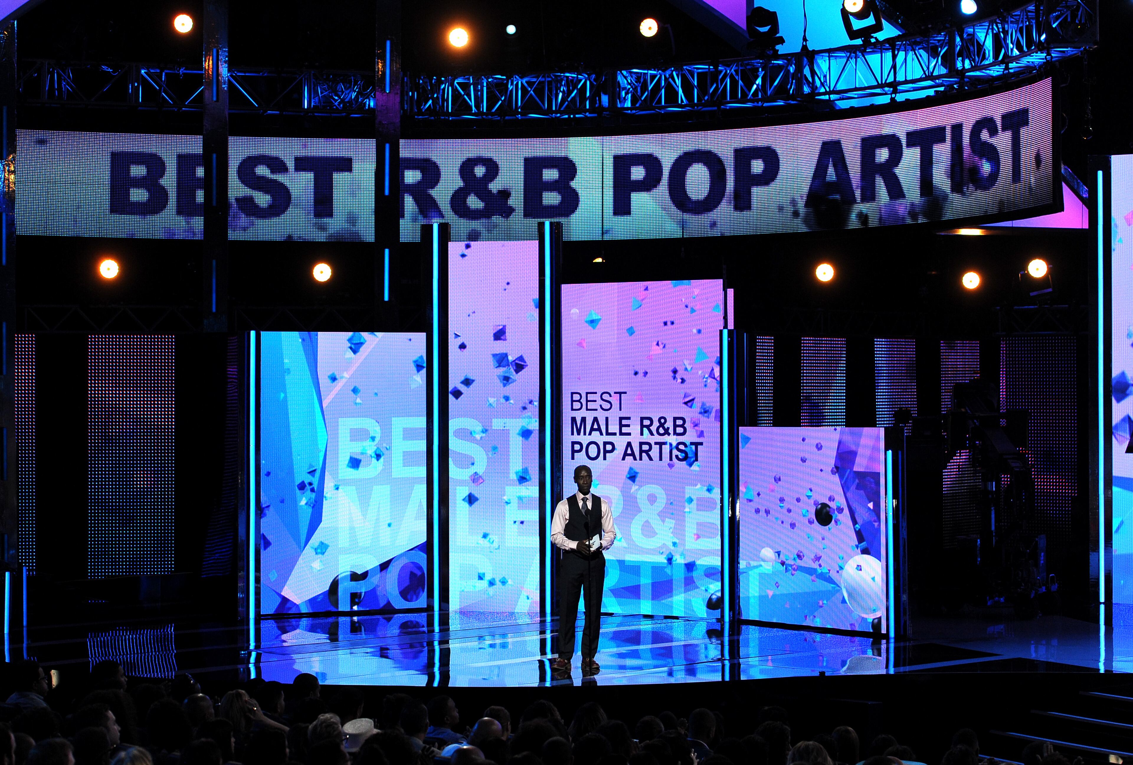 Don Cheadle presents the award for best male R&B pop artist at the BET Awards at the Nokia Theatre on Sunday, June 30, 2013, in Los Angeles. (Photo by Frank Micelotta/Invision/AP)