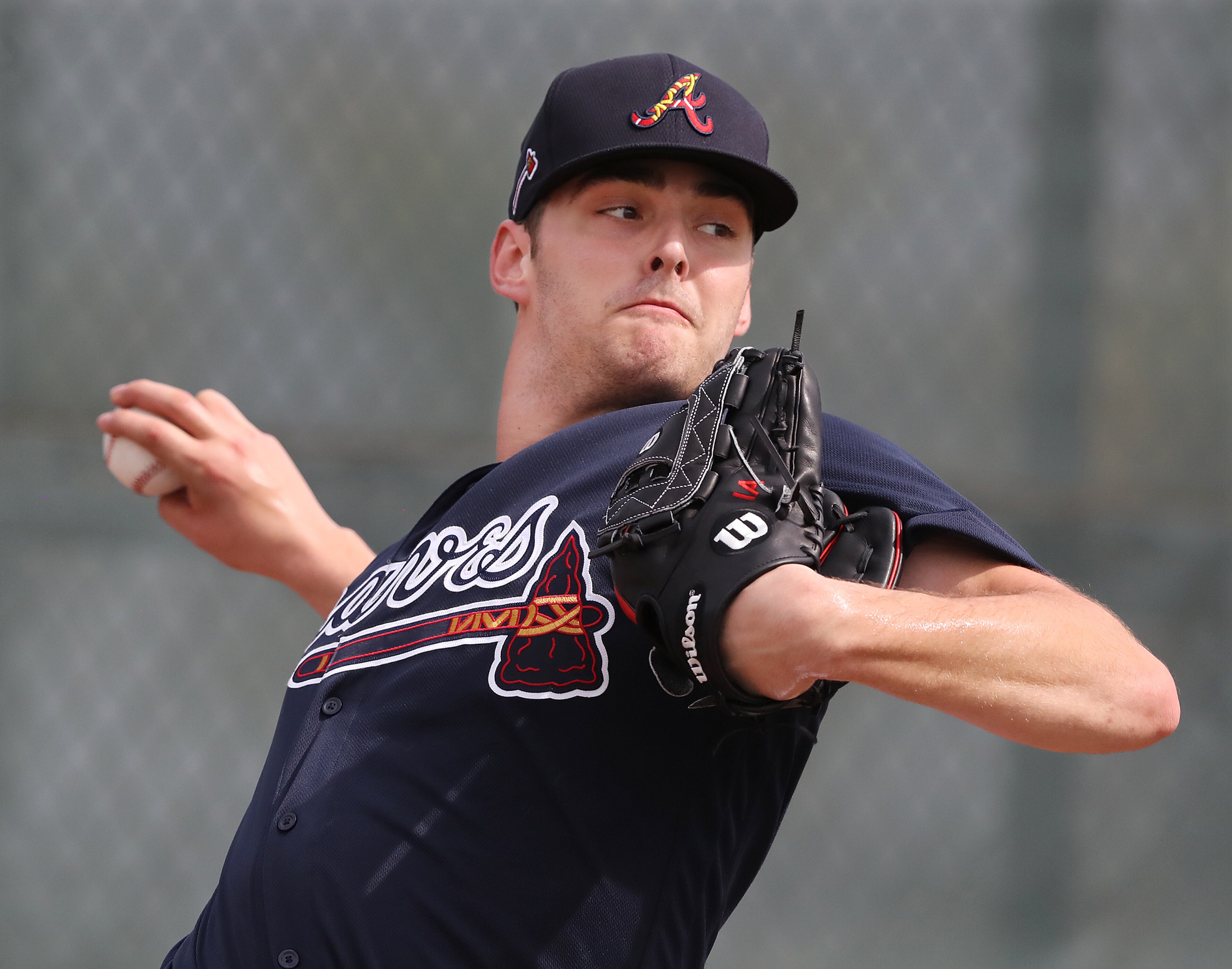 Braves pitcher Ian Anderson delivers a pitch working from the mound during spring training on Friday, Feb. 14, 2020, in North Port. Curtis Compton ccompton@ajc.com