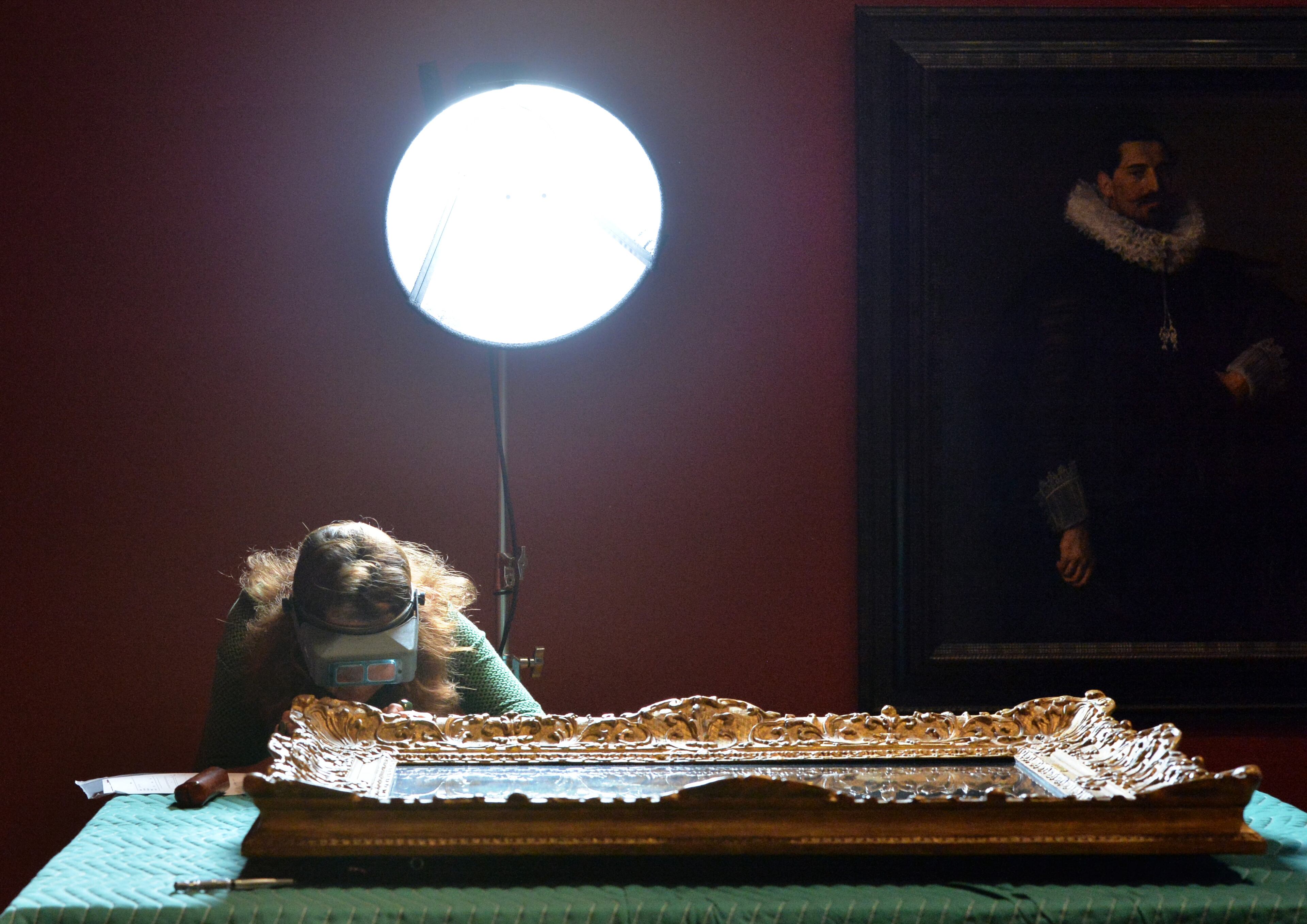 Sabrina Meloni, painting conservator from the Mauritshuis, conducts condition reporting on "Portrait of an Elderly Man," 1667, by Rembrandt.