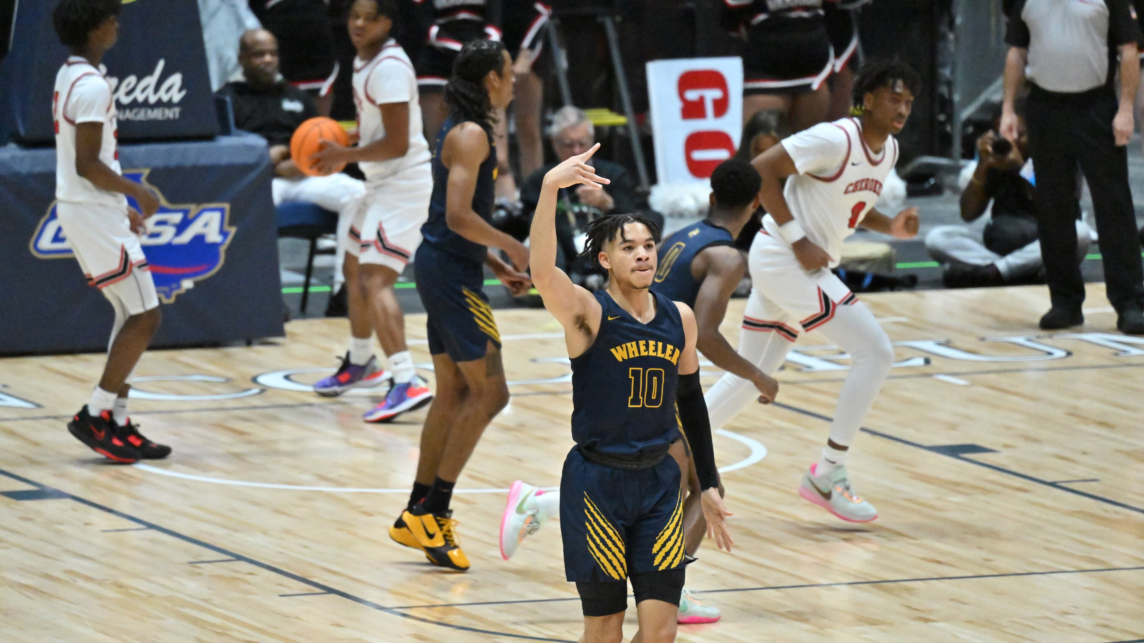 Wheeler's Jelani Hamilton (10) celebrates after scoring during 2023 GHSA Basketball Class 7A Boy’s State Championship game at the Macon Centreplex, Saturday, March 11, 2023, in Macon, GA. (Hyosub Shin / Hyosub.Shin@ajc.com)