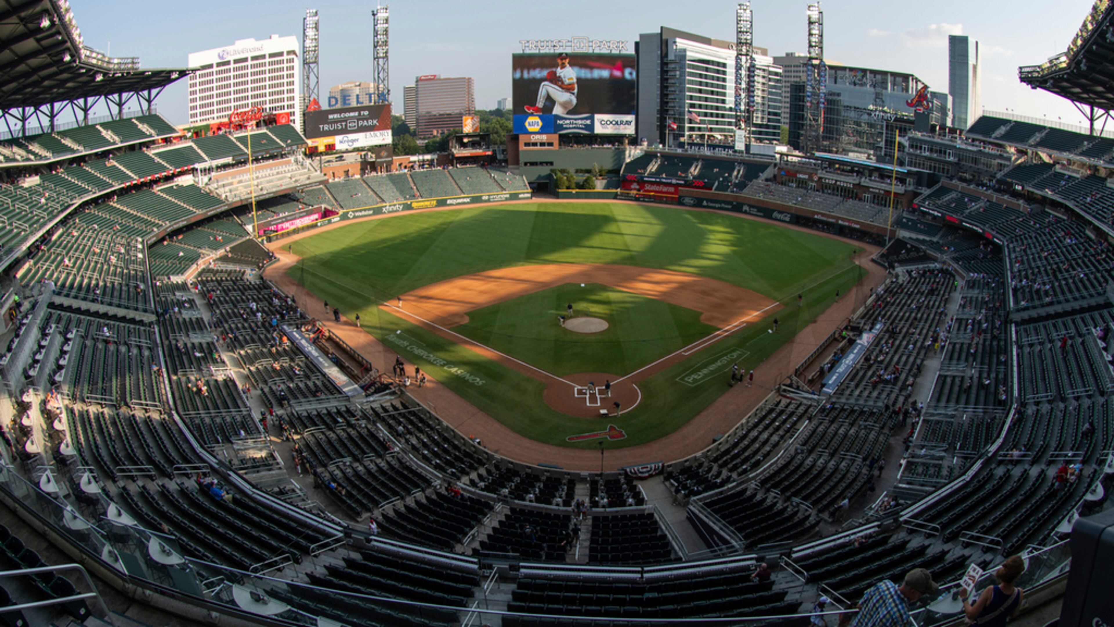 Fans wait for a baseball game between the Atlanta Braves and the New York Mets at Truist Park, Wednesday, Aug. 23, 2023, in Atlanta. (AP Photo/Hakim Wright Sr.)