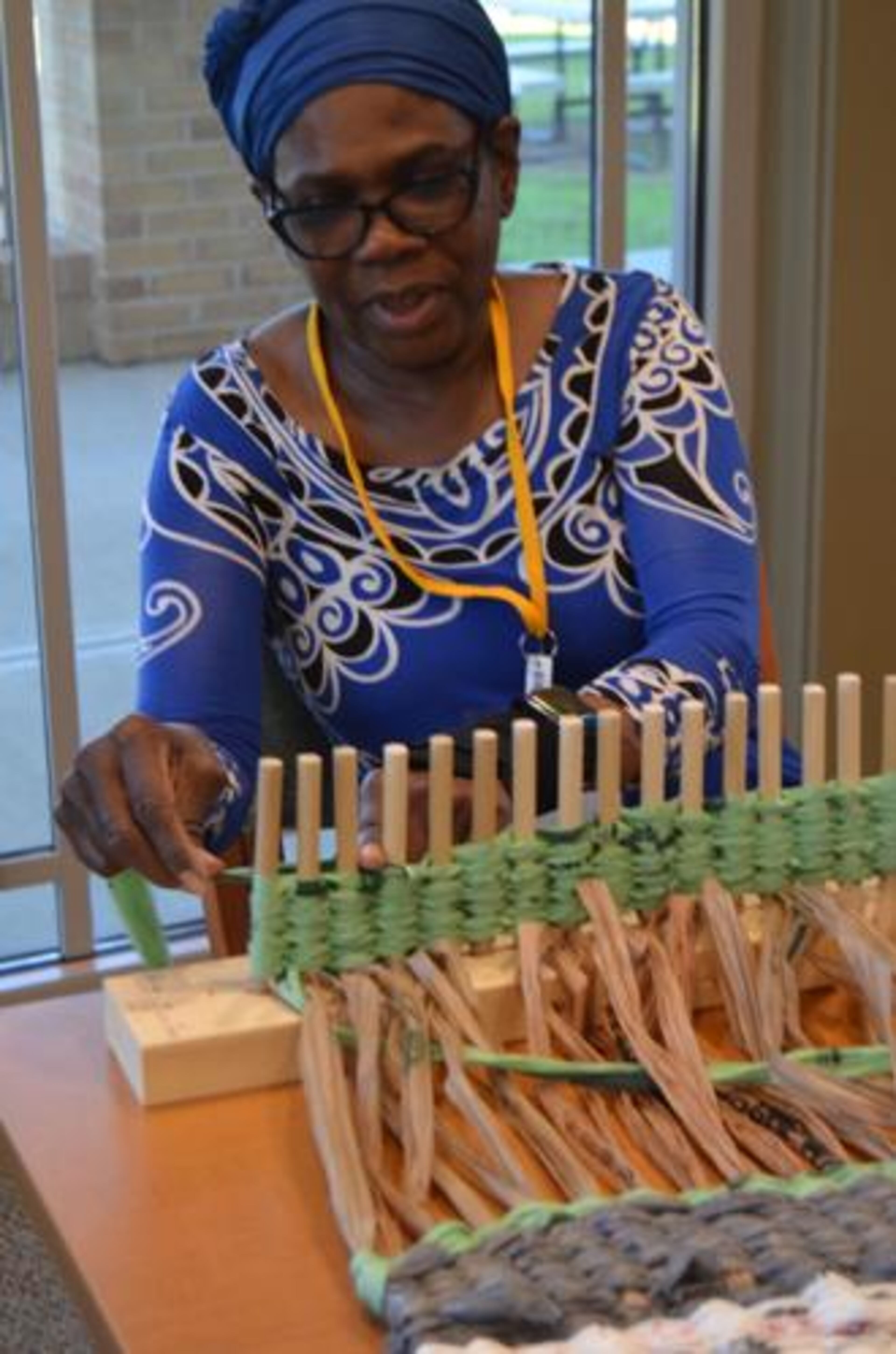 Colleen Barrett weaves a mat on Wednesday. Since the SOWEGA Council on Aging's plarn project was launched in fall 2022, the group has completed 10 mats, seven of which have been donated to the Albany Rescue Mission for distribution to homeless people. (Photo Courtesy of Alan Mauldin)