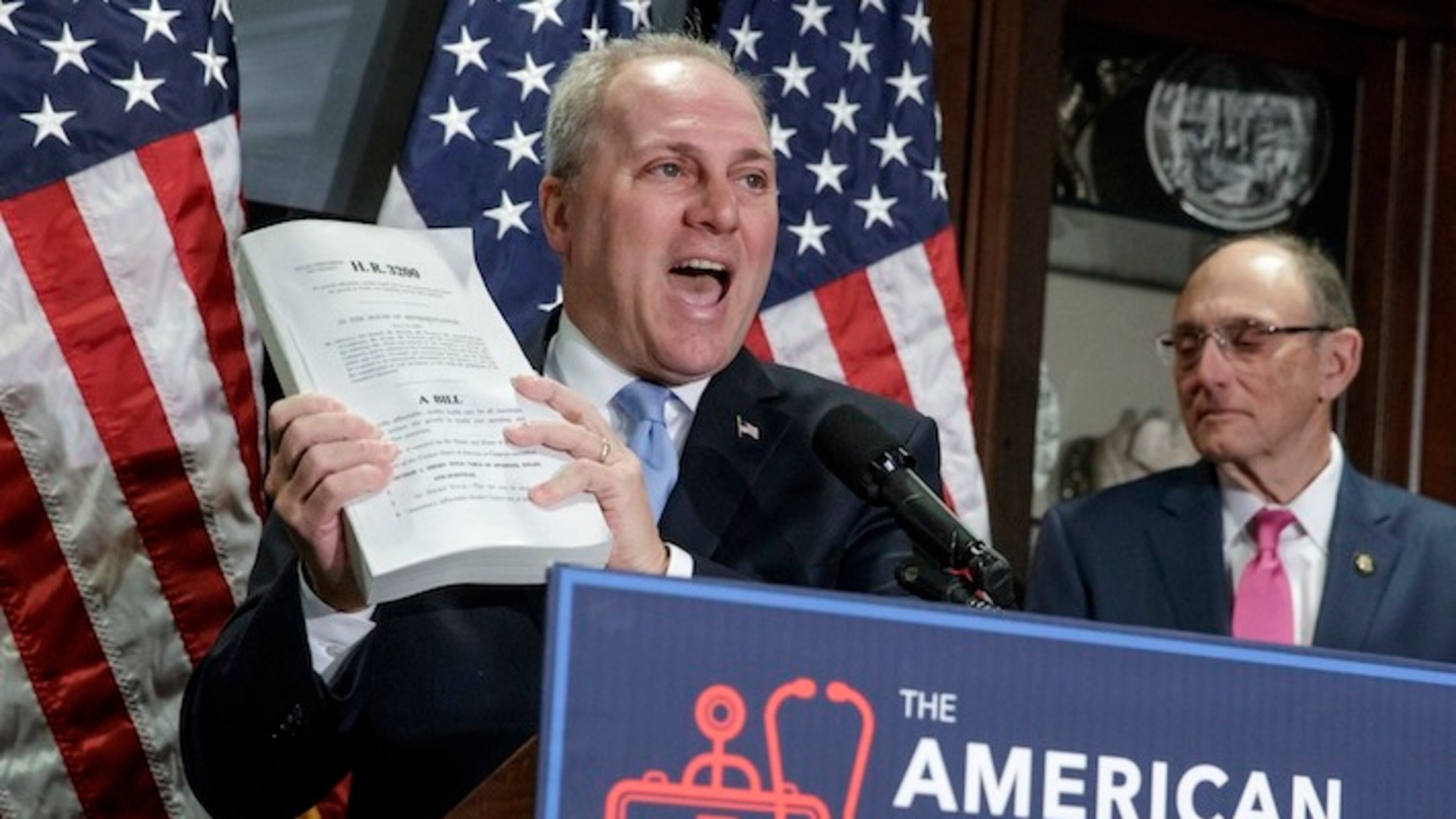 House Majority Whip Steve Scalise, R-La., joined at right Rep. Phil Roe, R-Tenn., holds up a copy of the original Affordable Care Act bill as the GOP leadership talks to reporters about its work on the long-awaited Republican plan to repeal and replace "Obamacare," during a news conference on Capitol Hill in Washington, Wednesday, March 8, 2017. (AP Photo/J. Scott Applewhite)