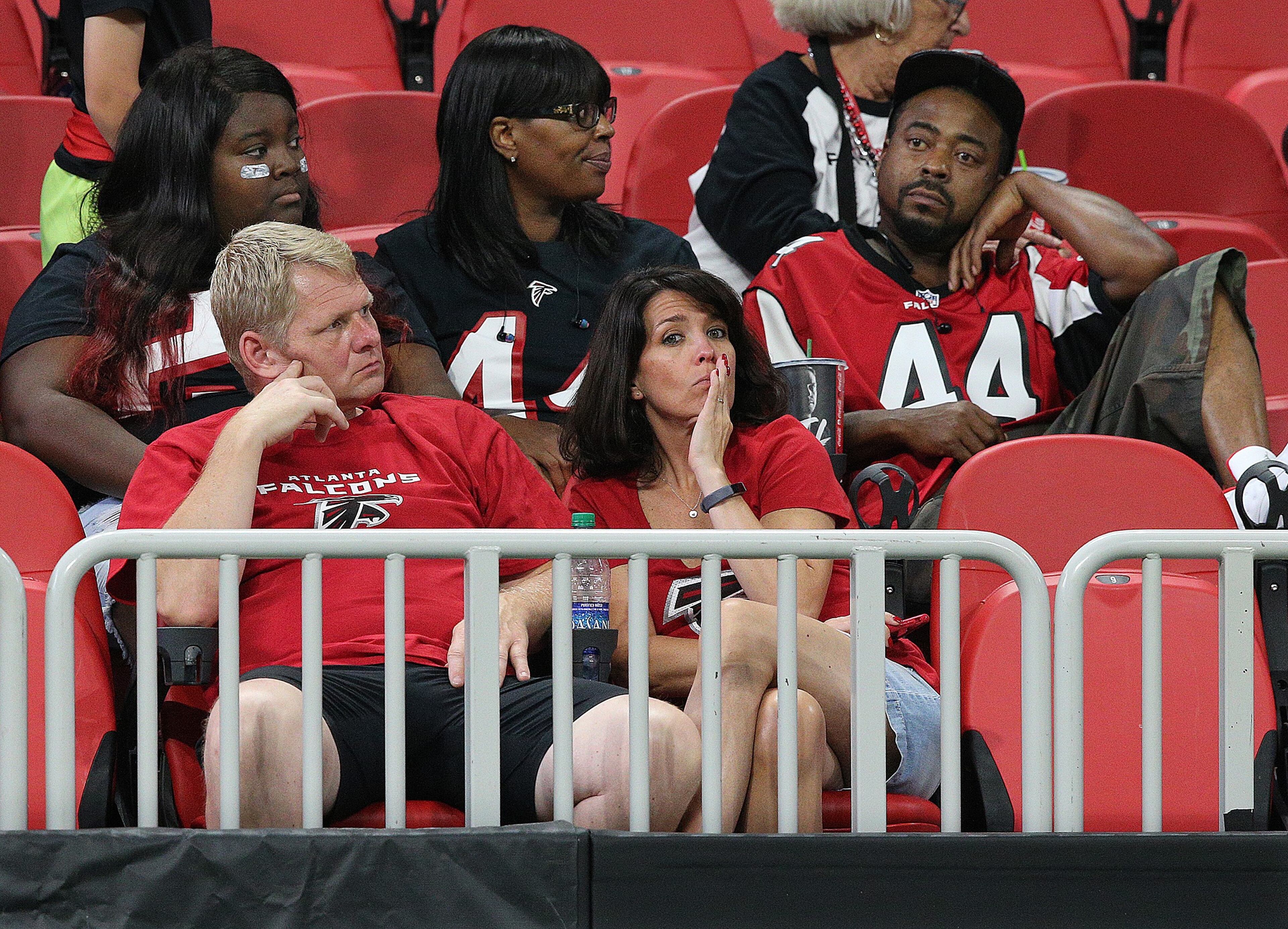 September 23, 2018 Atlanta: Atlanta Falcons fans sit dejected in the stands after falling 43-37 to the New Orleans Saints during overtime in an NFL football game on Sunday, Sept 23, 2018, in Atlanta. Curtis Compton/ccompton@ajc.com
