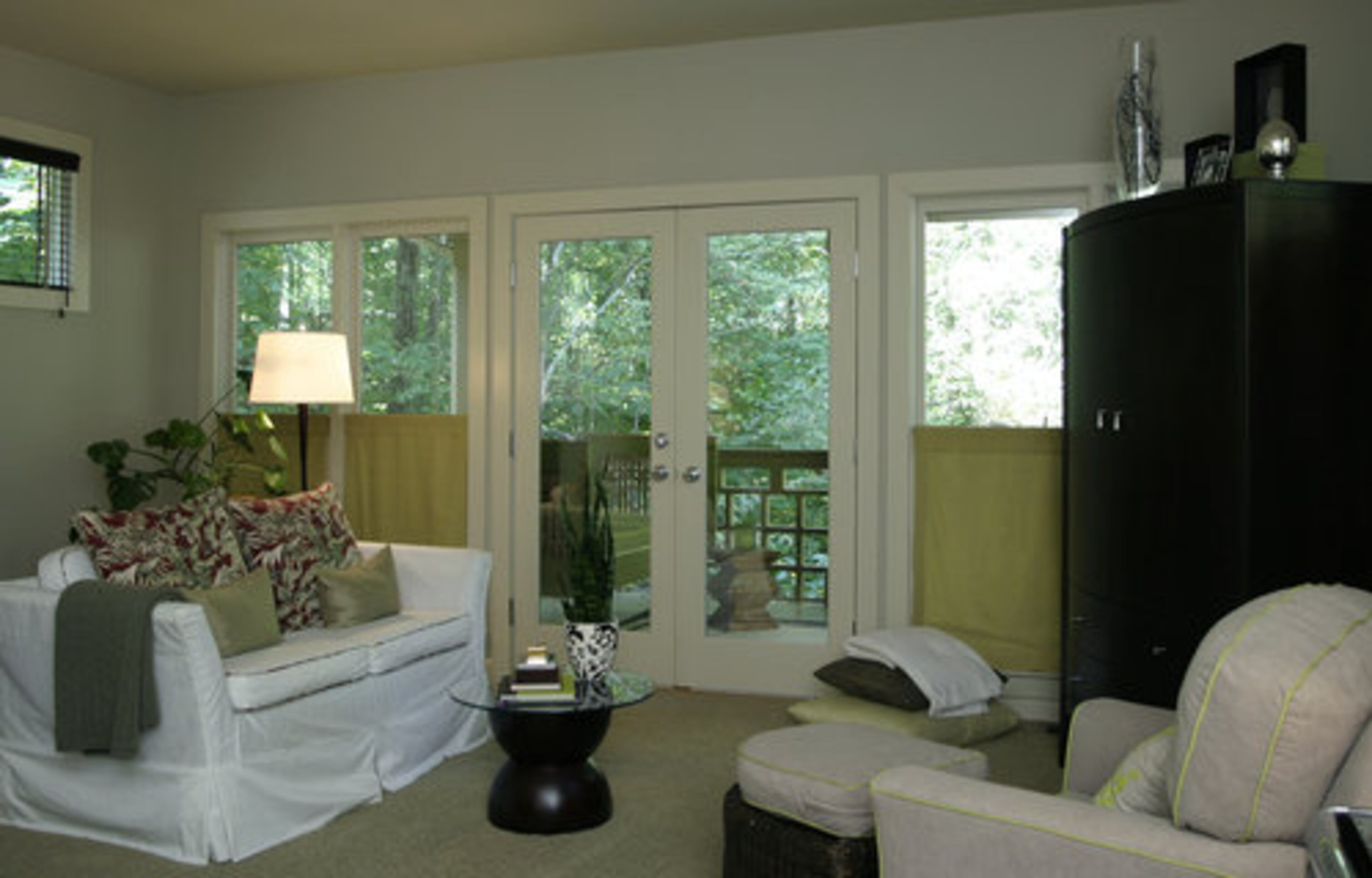 The master bedroom includes a sitting area that opens onto a private deck.