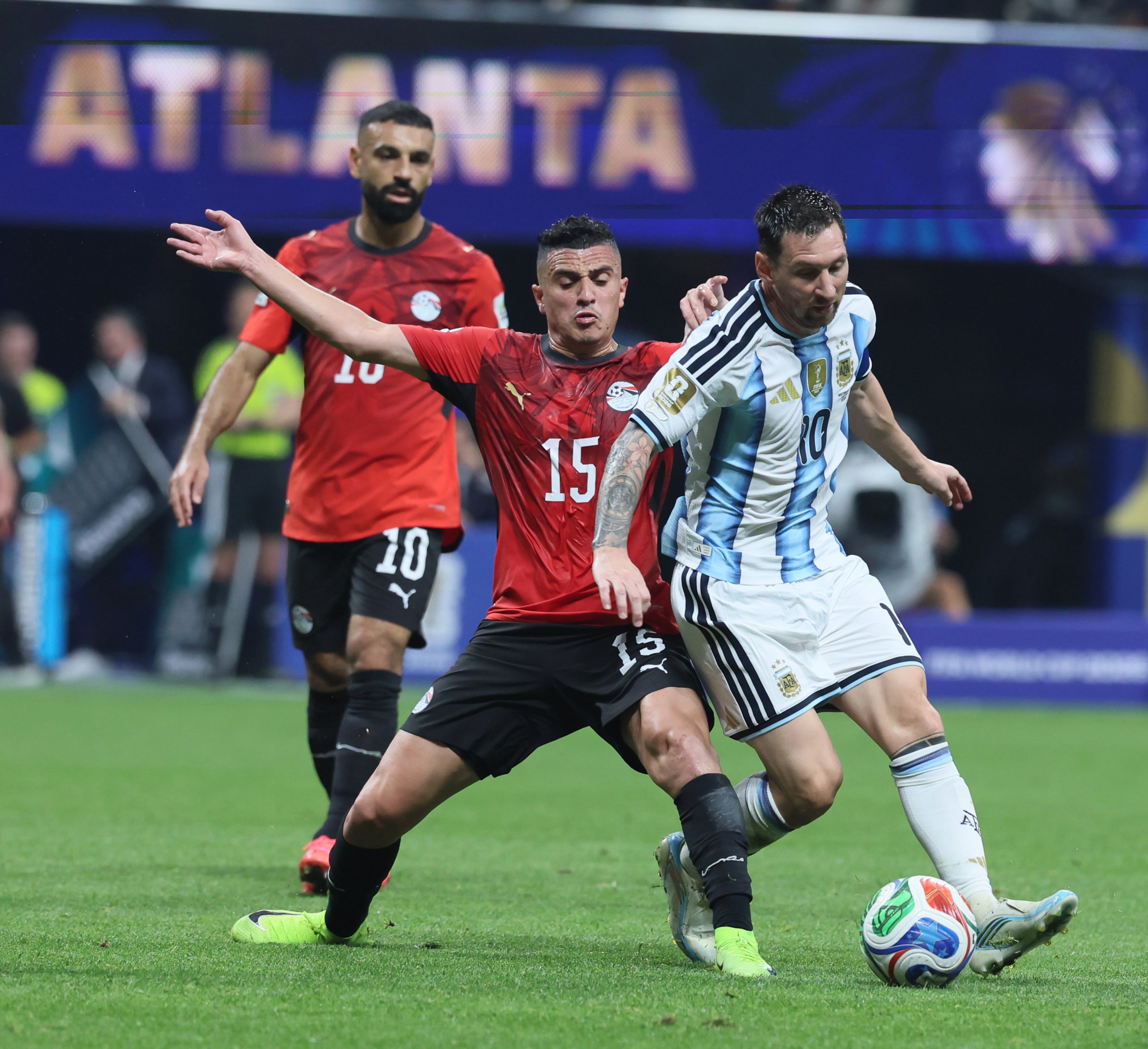Argentina's Lionel Messi, right, wins battle for the ball with Egypt's Karim Hafez during first half of Argentina vs. Egypt FIFA World Cup match at Atlanta Stadium (Mercedes-Benz Stadium) on Tuesday, July 7, 2026. (Jason Getz/AJC)