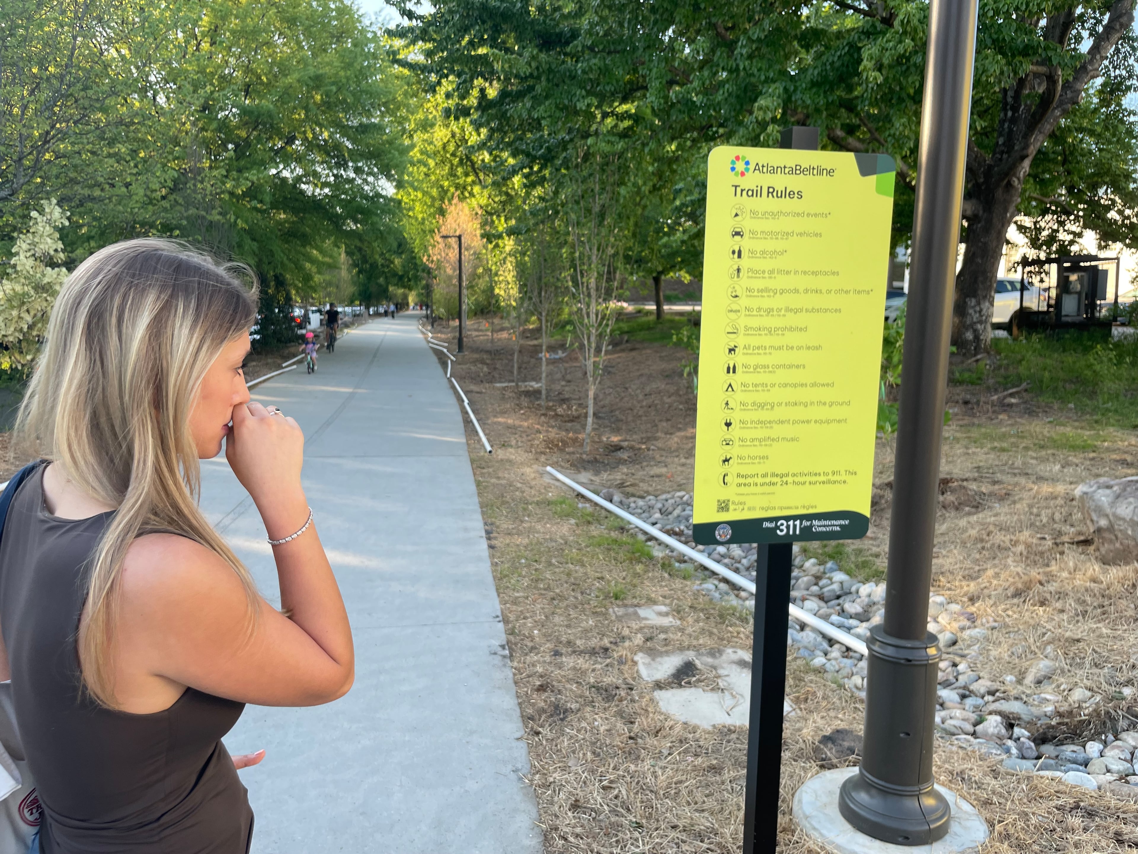 Patrisiya Rumyantseva takes a look at the Atlanta Beltline's rules. She was struck by a Lime e-bike a month earlier and knocked to the pavement, where she hit her head. (Bill Torpy/AJC)