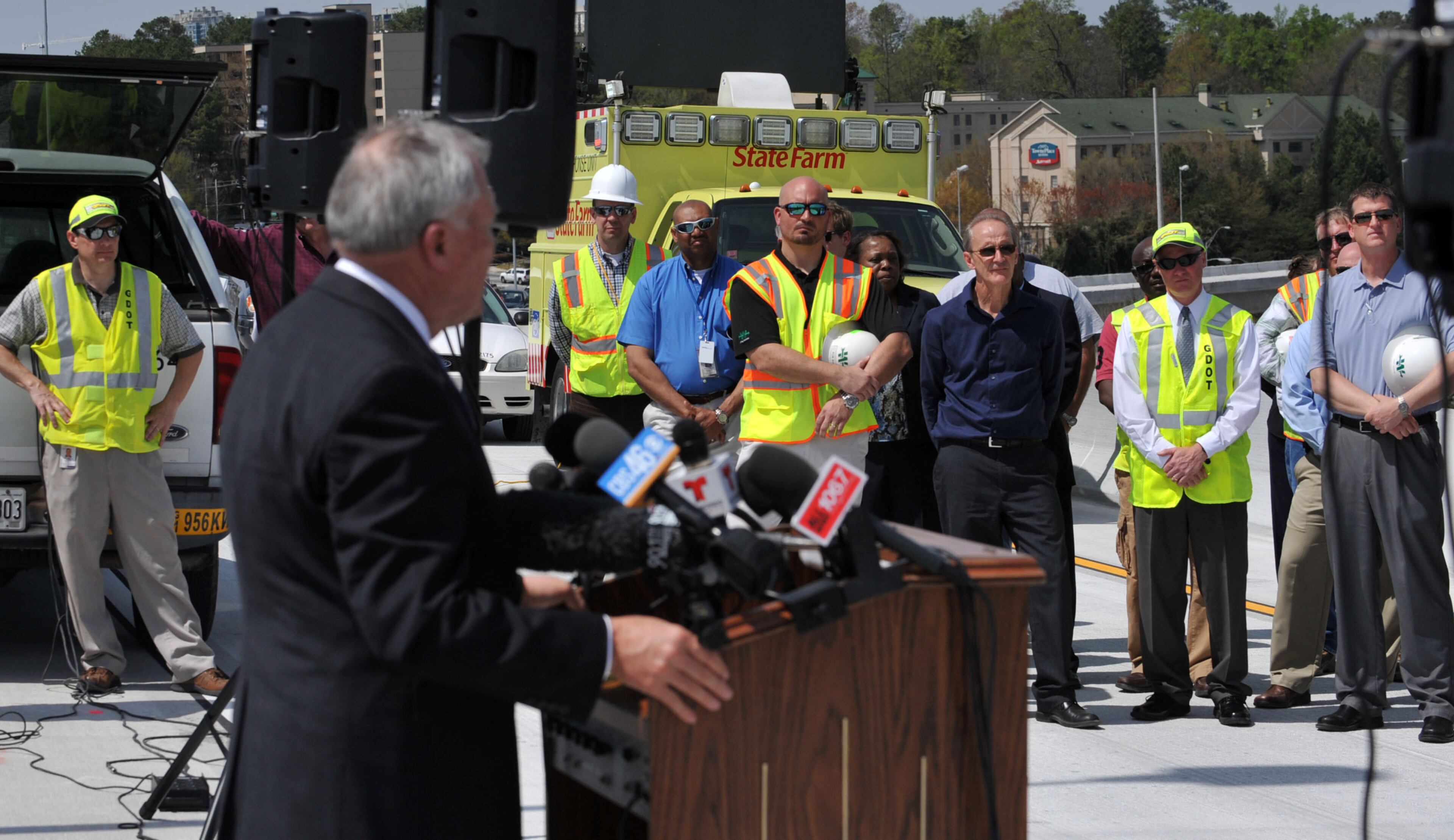GDOT workers and staff listen as Governor Nathan Deal gives remarks during the program. Deal and other state and local leaders conducted a brief ribbon-cutting celebration of the opening of the new flyover ramps Wednesday, April 2, 2014. The ramps provide I-85 southbound traffic with direct access to GA 400 northbound and also give GA 400 southbound motorists a direct ramp to I-85 northbound.