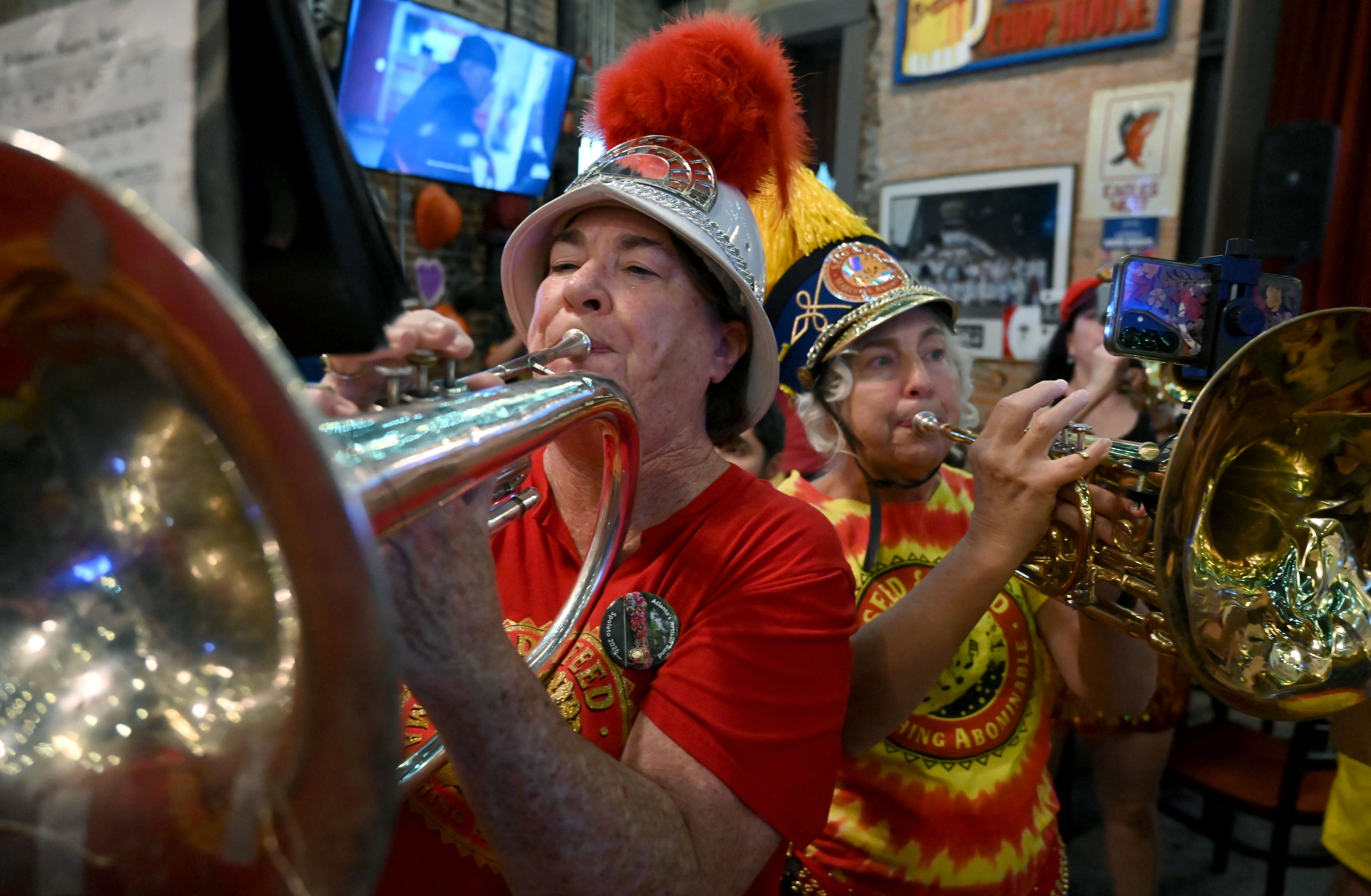 The Seed & Feed Marching Abominable performs during Manuel’s Tavern’s 70th anniversary celebration. (Hyosub Shin/AJC)