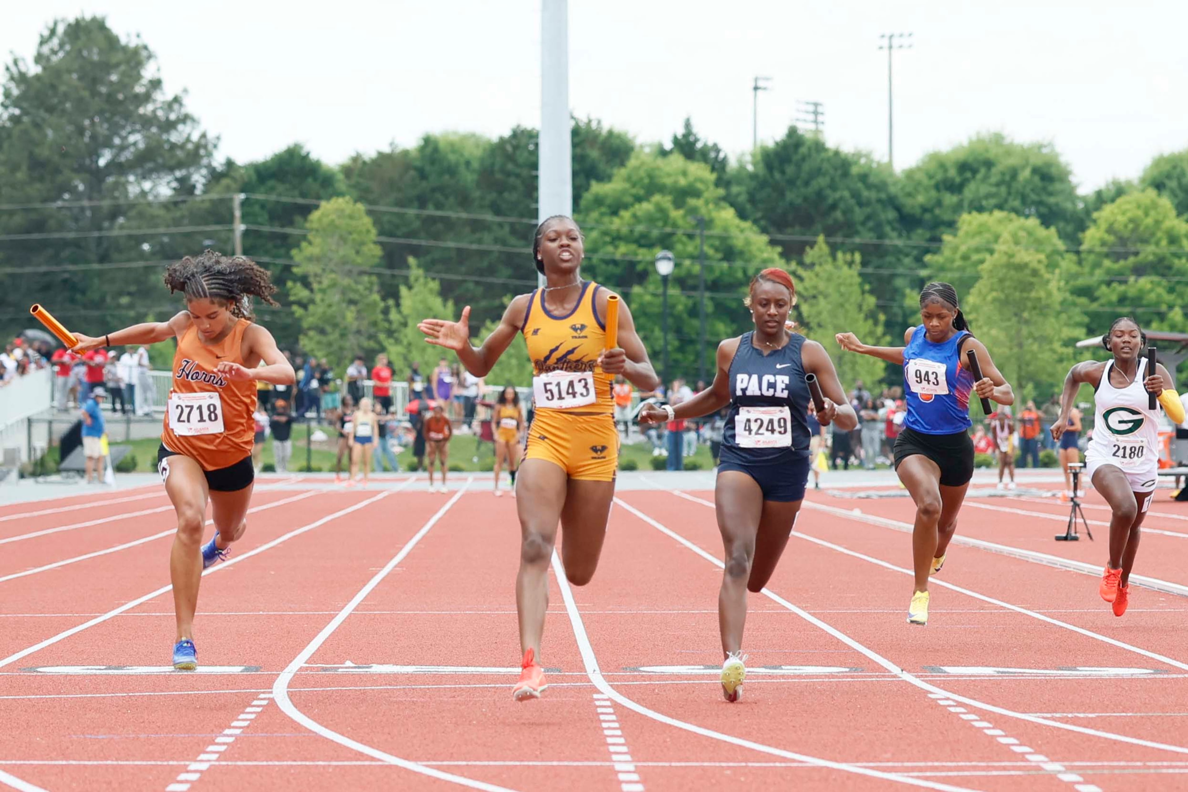 Southwest DeKalb runner, second from the left, reacts after helping her team win the Girls 4x100 Meter Relay AAAA at the GHSA Track and Field State Championship held at UGA Spec Towns Track on Monday, May 11, 2026, in Athens.
(Miguel Martinez/AJC)