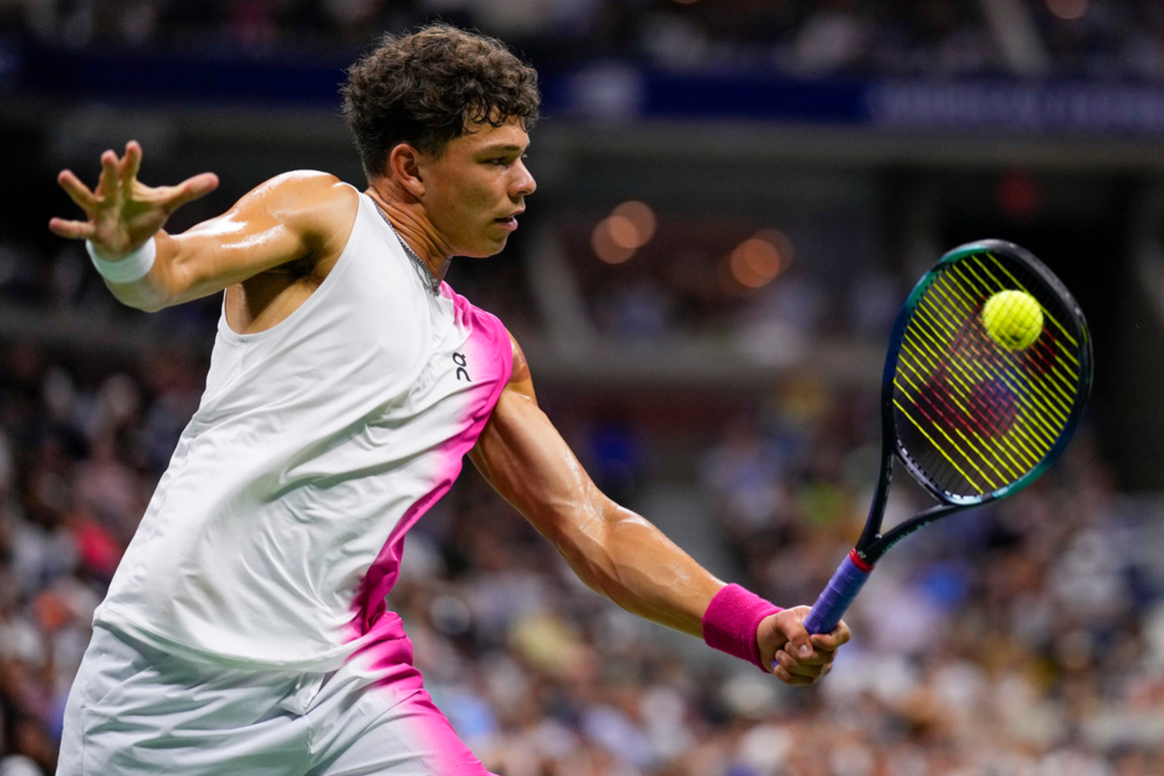 Ben Shelton, of the United States, returns a shot to Novak Djokovic, of Serbia, during the men's singles semifinals of the U.S. Open tennis championships, Friday, Sept. 8, 2023, in New York. (AP Photo/Manu Fernandez)