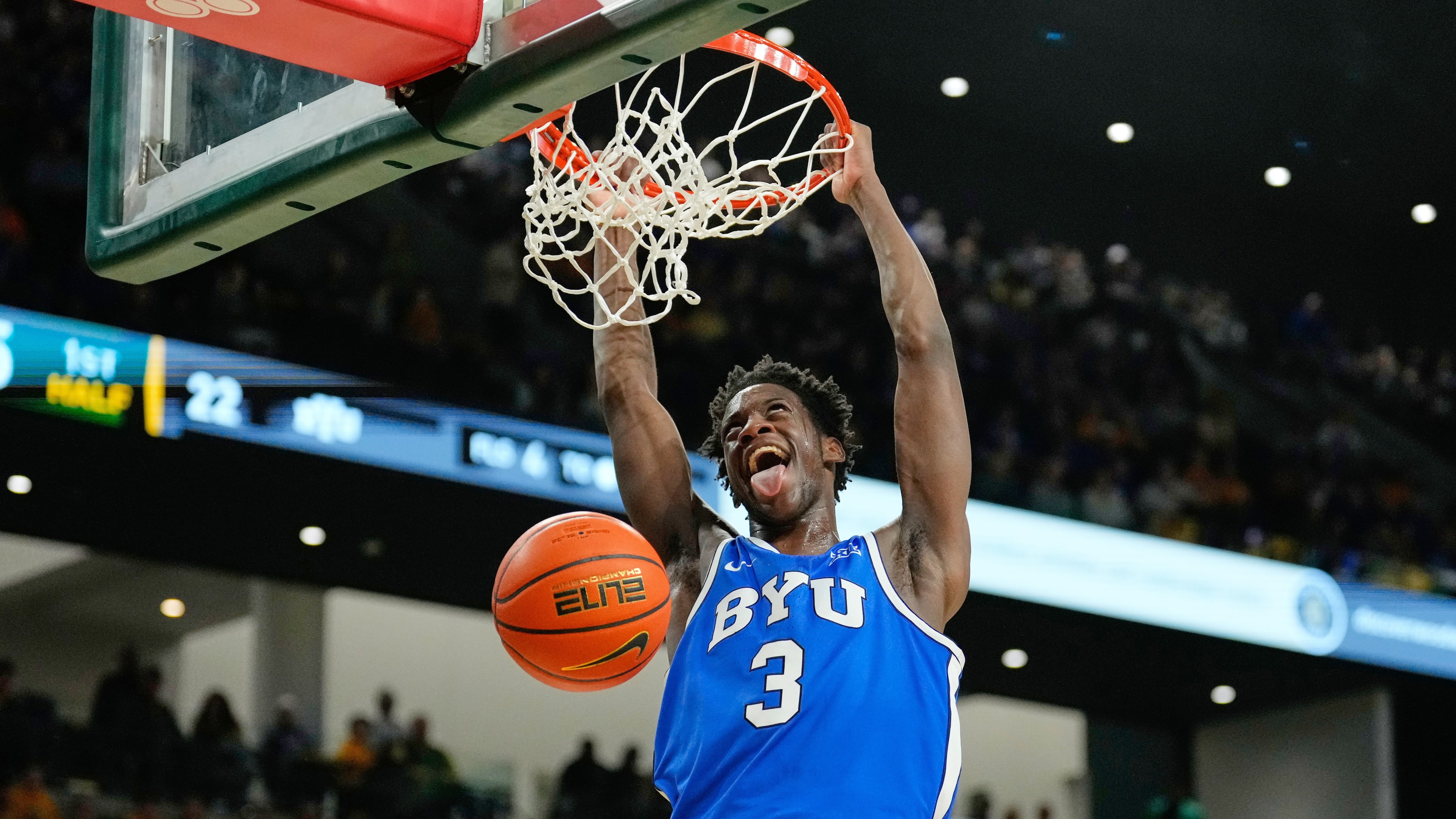 FILE - BYU forward AJ Dybantsa dunks in the first half of an NCAA college basketball game against Baylor Tuesday, Feb. 10, 2026, in Waco, Texas. (AP Photo/Tony Gutierrez, File