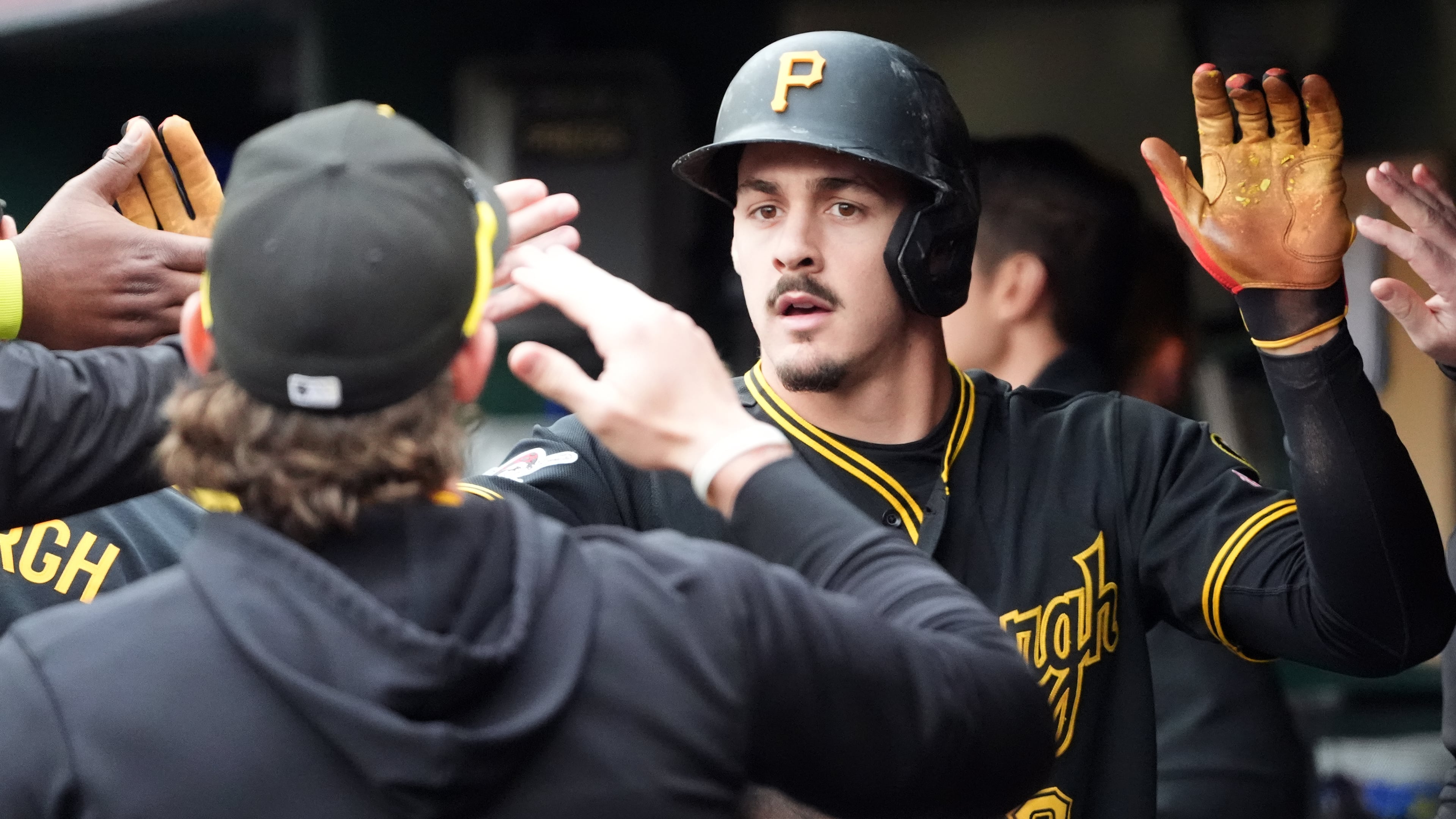 Pittsburgh Pirates' Konnor Griffin is greeted by his teammates after scoring on a single by Oneil Cruz against the Cincinnati Reds in the fourth inning of a baseball game in Pittsburgh, Saturday, May 2, 2026. (AP Photo/Tom E. Puskar)