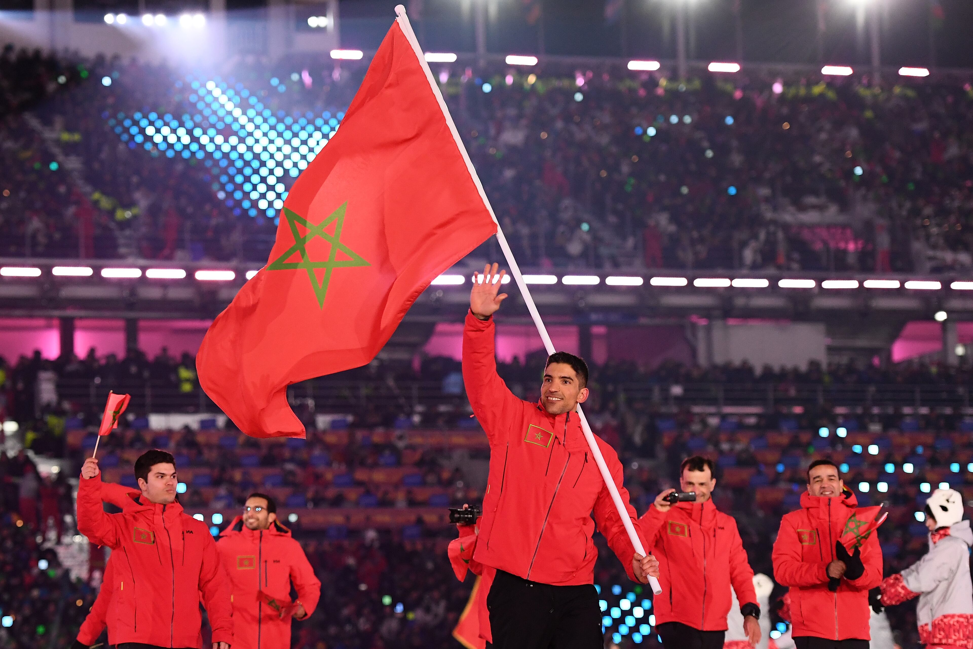 PYEONGCHANG-GUN, SOUTH KOREA - FEBRUARY 09: Flag bearer Samir Azzimani of Morocco leads out his country during the Opening Ceremony of the PyeongChang 2018 Winter Olympic Games at PyeongChang Olympic Stadium on February 9, 2018 in Pyeongchang-gun, South Korea. (Photo by Quinn Rooney/Getty Images)