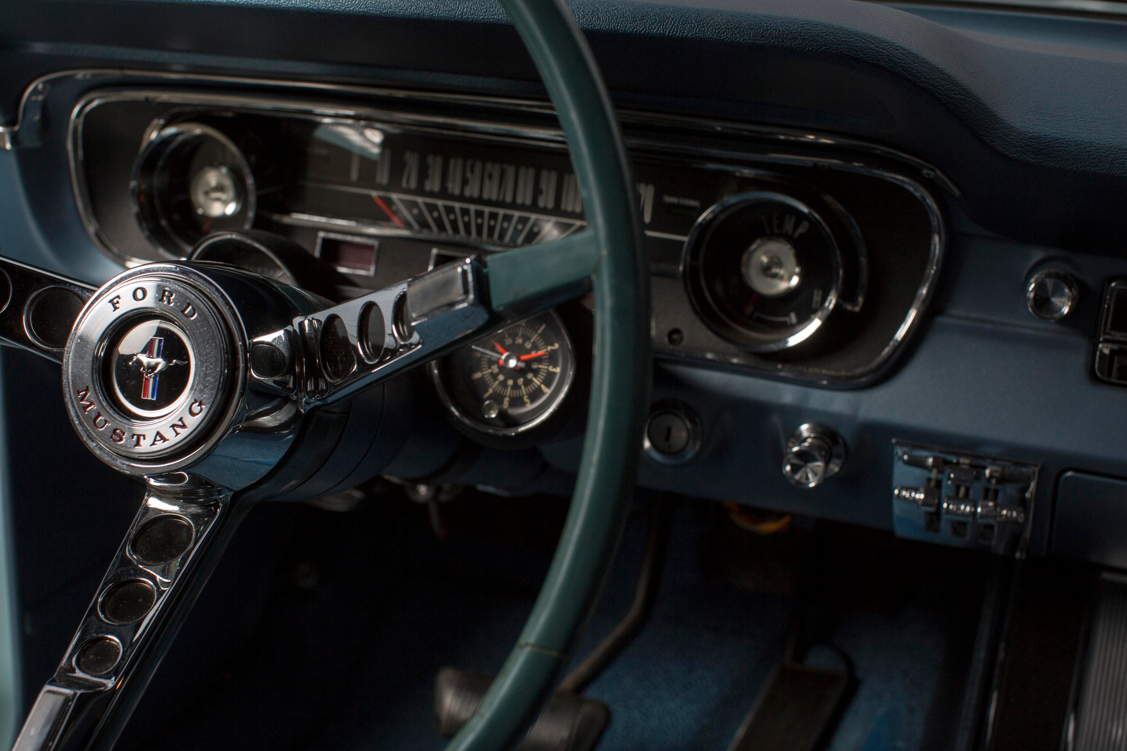 The steering wheel of Gail Wise's Skylight Blue 1964 1/2 Ford Mustang is seen in Park Ridge, Illinois November 26, 2013. Gail Wise, then using her maiden name of Gail Brown, made the first known retail purchase of a Mustang on April 15, 1964, two days before the model went on sale. Ford will unveil its next-generation 2015 Mustang on December 5, 2013 for the model's 50th anniversary with simultaneous events in Michigan, Shanghai, Sydney, Barcelona, New York and Los Angeles. REUTERS/John Gress