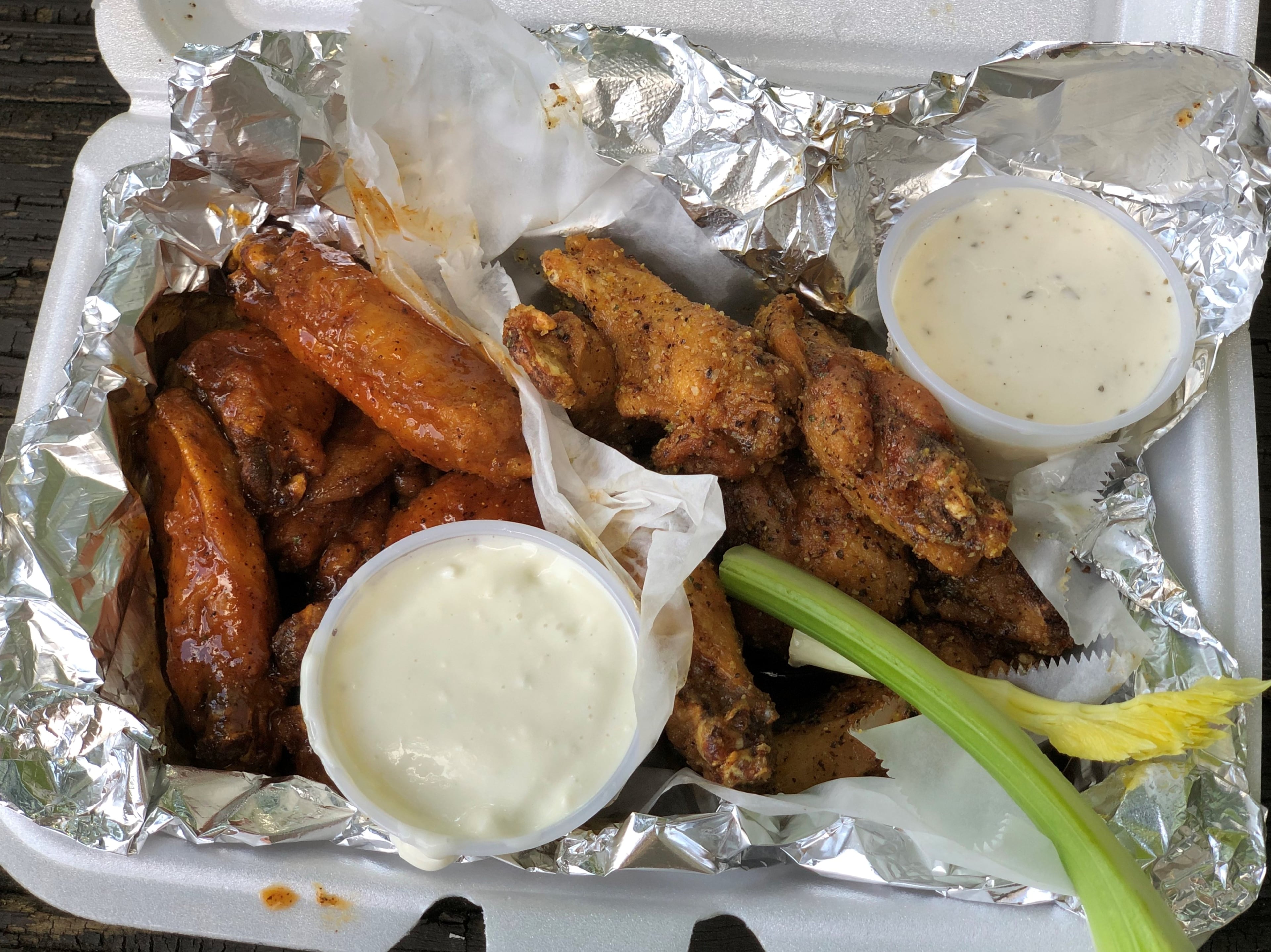 An order of 10 wings from Taco Pete Bistro in Hapeville: five with house sauce (tangy-sweet with a hint of curry) and five with lemon-pepper.
Wendell Brock for The Atlanta Journal-Constitution