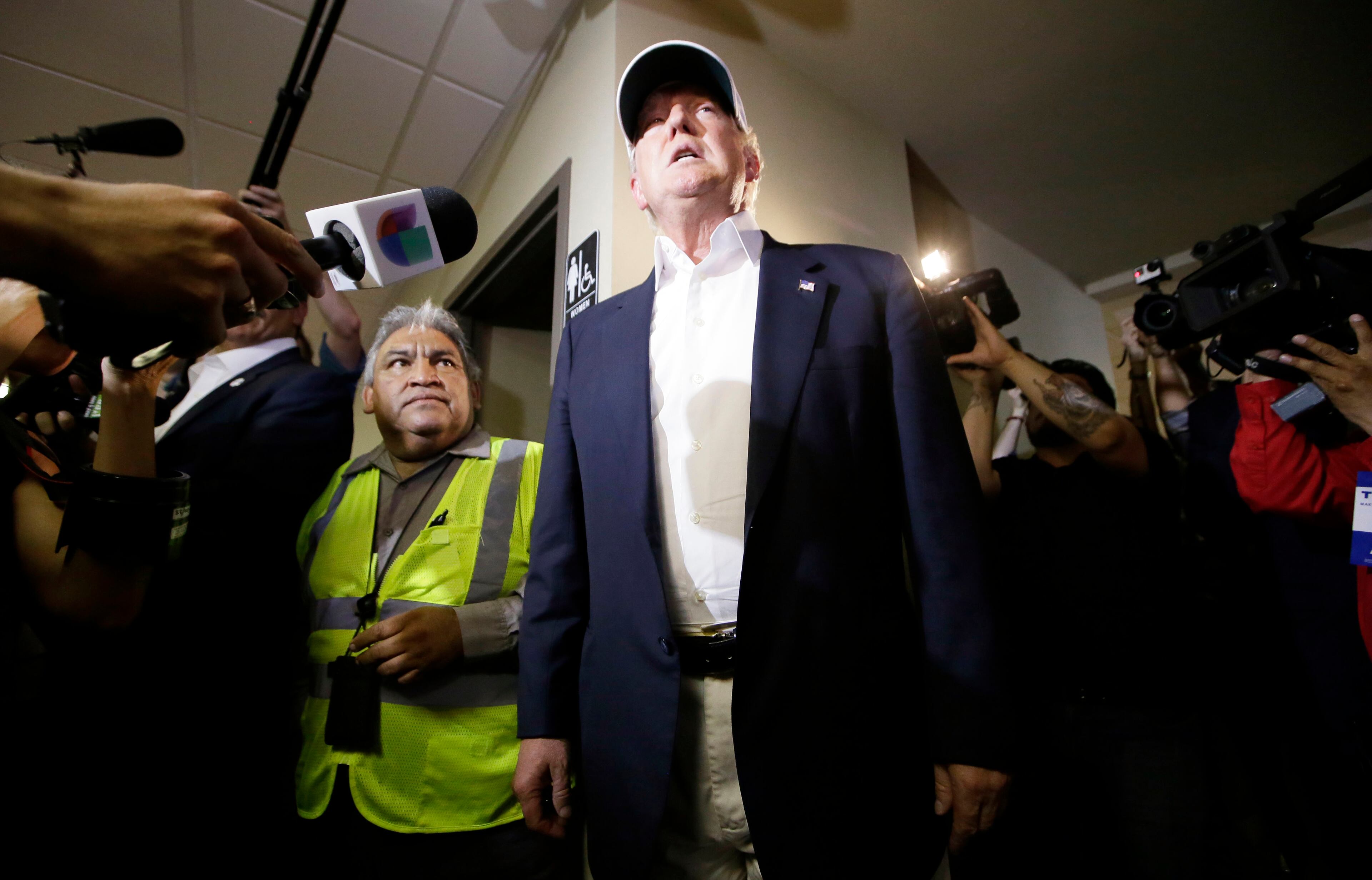 Republican presidential hopeful Donald Trump speaks to reporters after arriving for a visit to the U.S. Mexico border in Laredo, Texas, Thursday, July 23, 2015. (AP Photo/LM Otero)