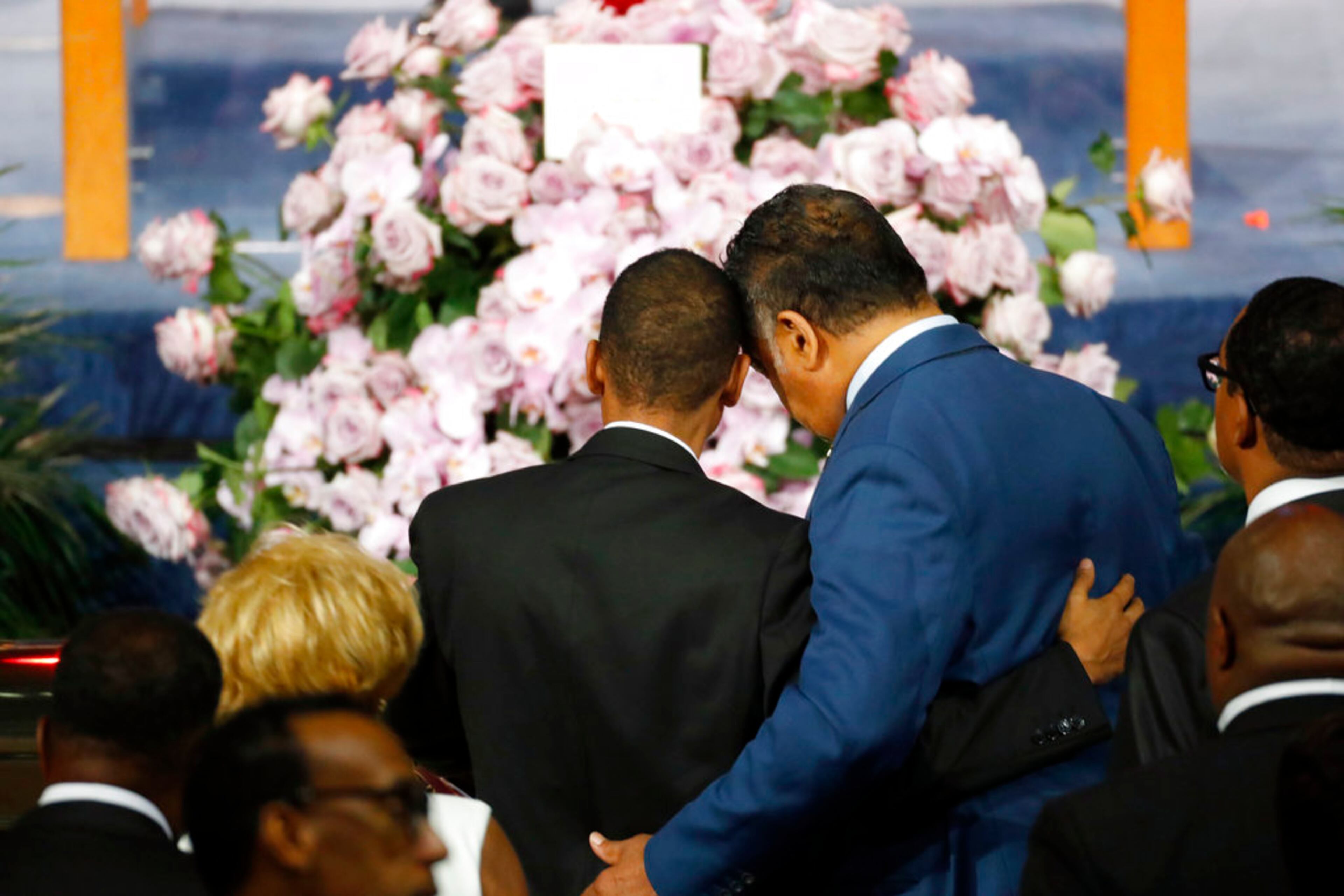 Rev. Jesse Jackson, right, consoles a family member as they pause at the casket of Aretha Franklin during her funeral service at Greater Grace Temple, Friday, Aug. 31, 2018, in Detroit. Franklin died Aug. 16, 2018 of pancreatic cancer at the age of 76. (AP Photo/Paul Sancya)