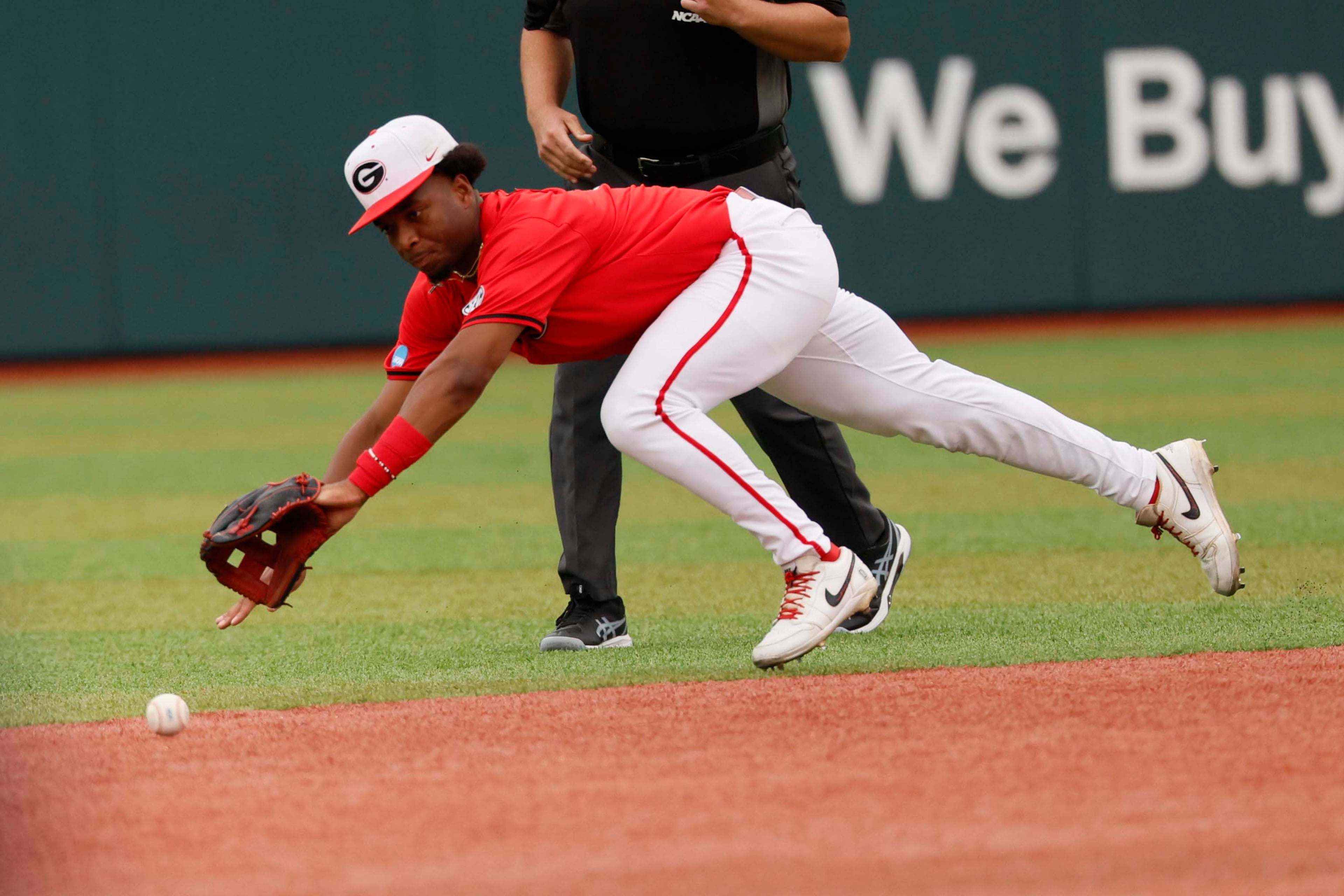 Georgia Bulldogs infielder Ryan Wynn (0) attempted to reach a ground ball during the first inning of their NCAA Regional final game at Foley Field on Sunday, May 31, 2026, in Athens.(Miguel Martinez/AJC)