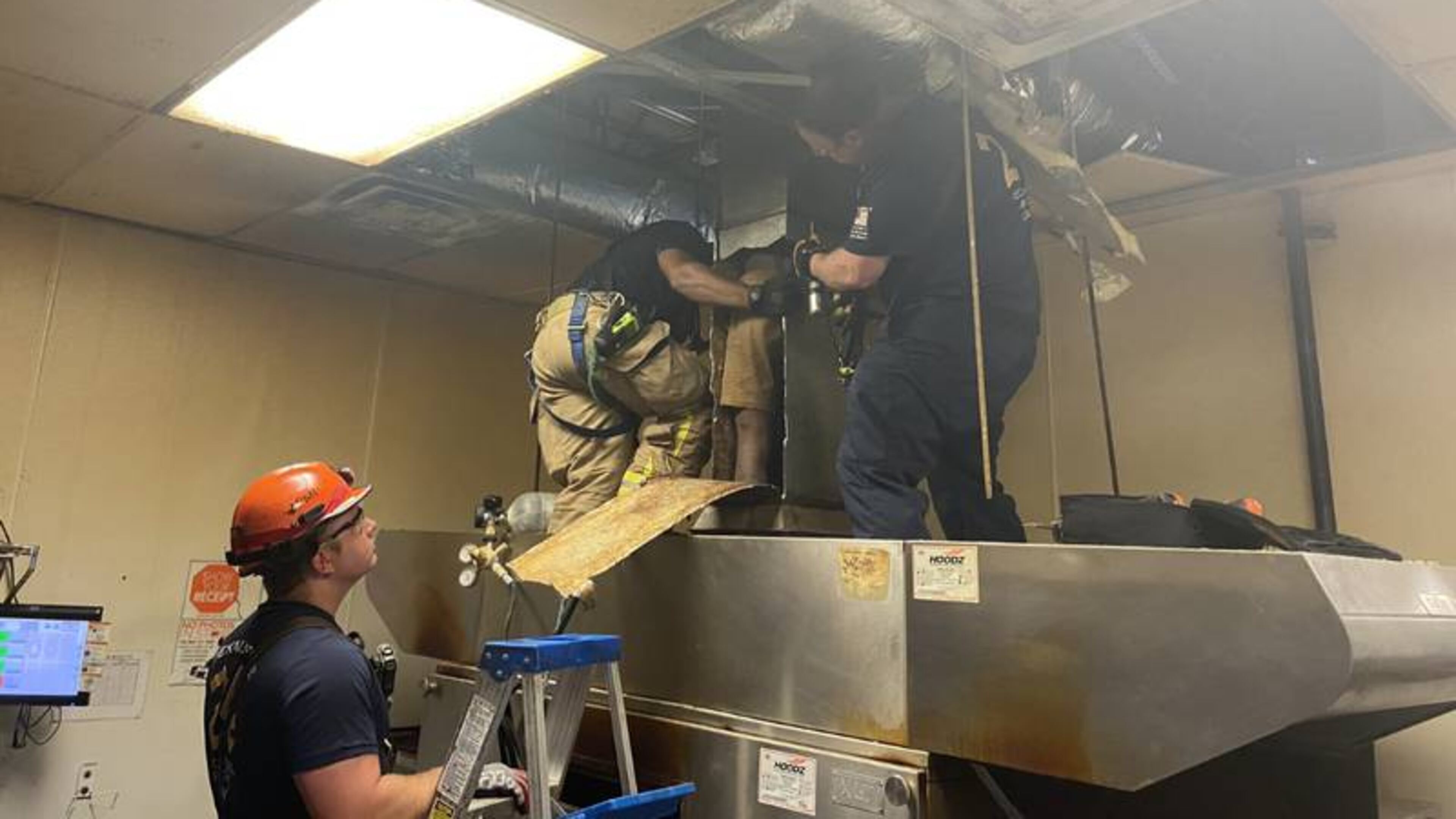 Firefighters and police were called to the Little Caesars at 6746 Covington Highway in Lithonia around 9:20 a.m. to help the man, DeKalb County officials confirmed.