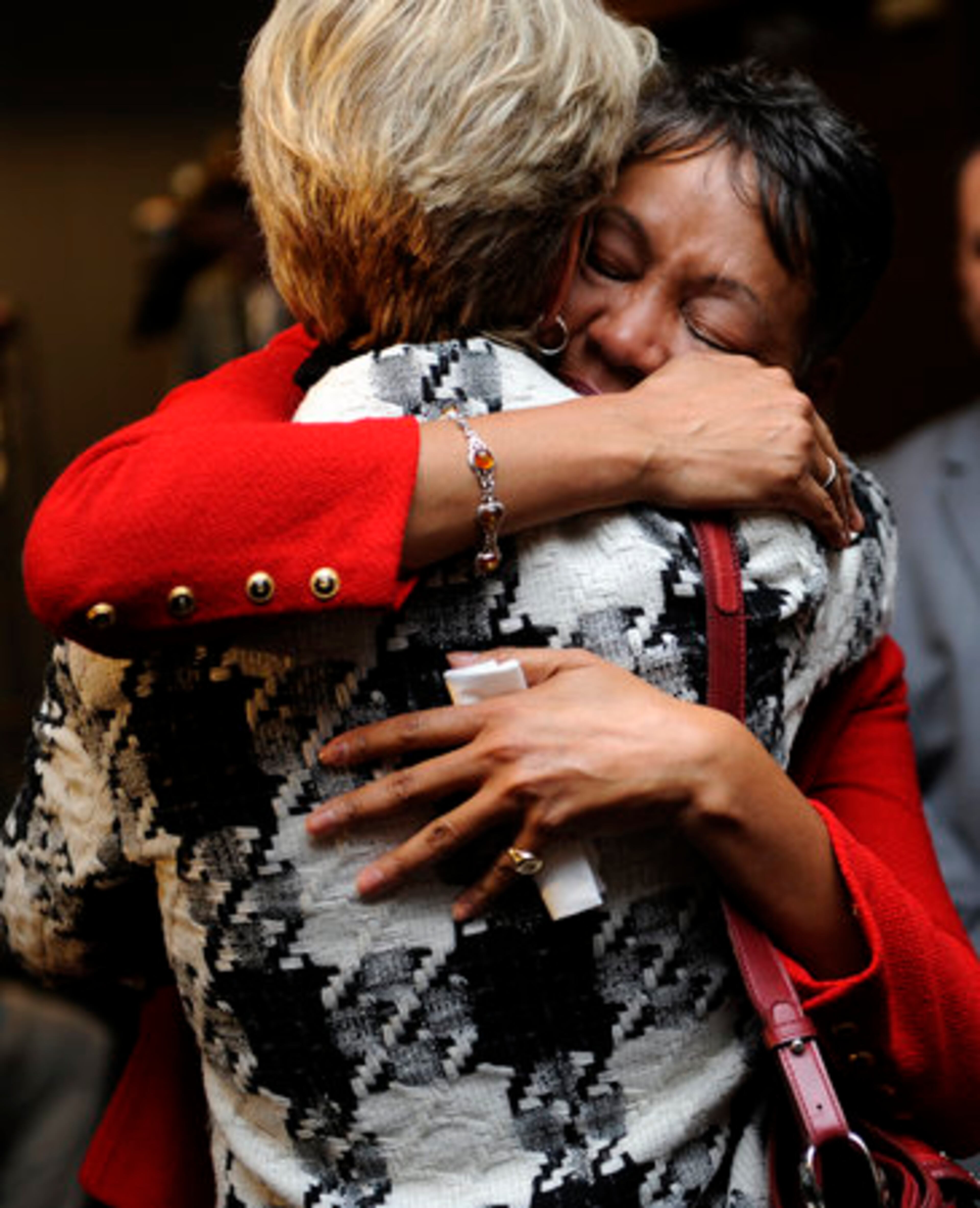 An emotional Lisa Borders hugs one of her supporters.