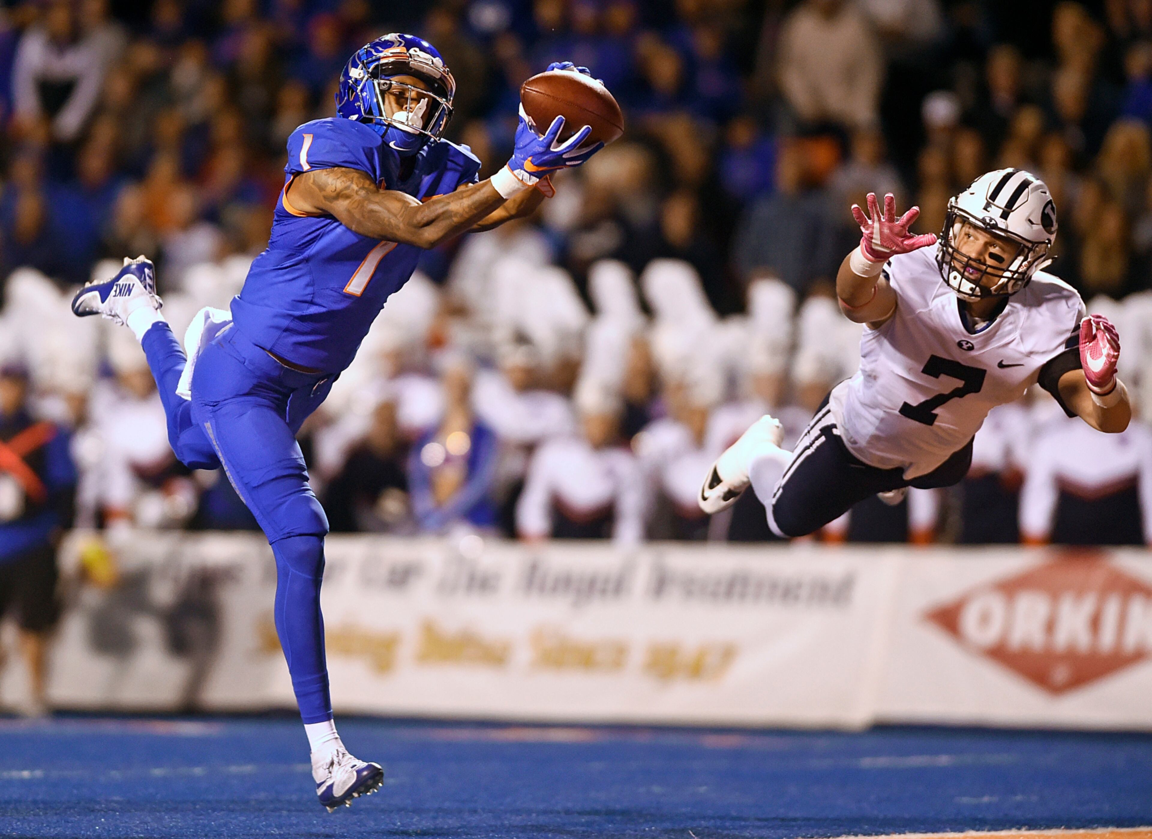 Boise State wide receiver Cedrick Wilson (1) catches a deep throw for a touchdown next to BYU defensive back Micah Hannemann (7) during an NCAA college football game Thursday, Oct. 20, 2016, in Boise, Idaho. (Pat Sutphin/The Times-News via AP)
