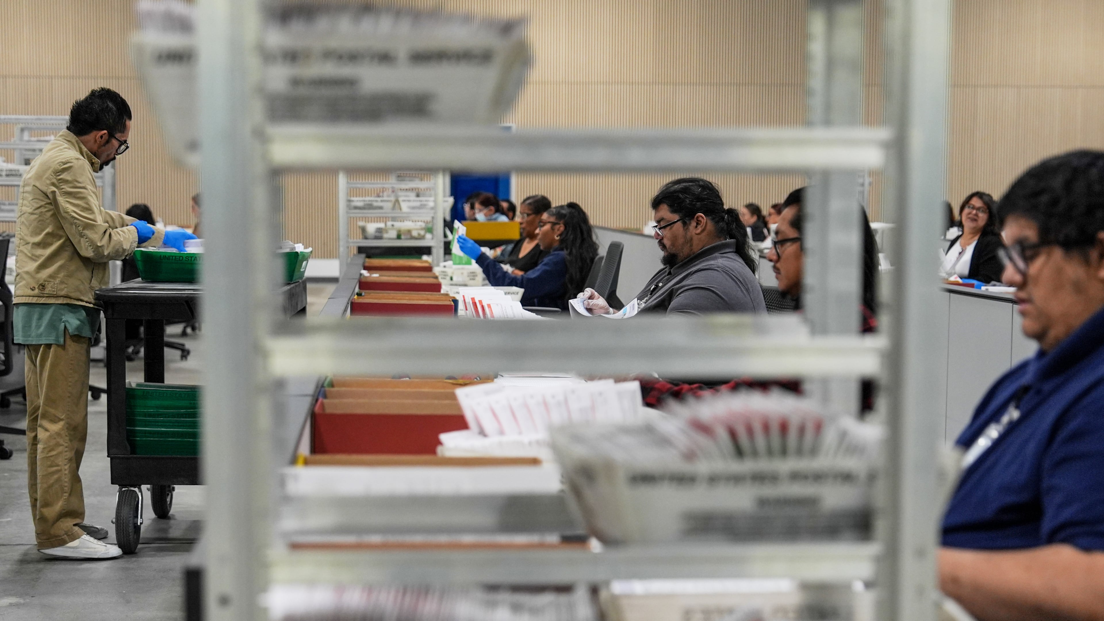 FILE - Ballots are inspected the day after California's primary election at the Los Angeles County Ballot Processing Center, June 3, 2026, in City of Industry, Calif. (AP Photo/Jae C. Hong, File)