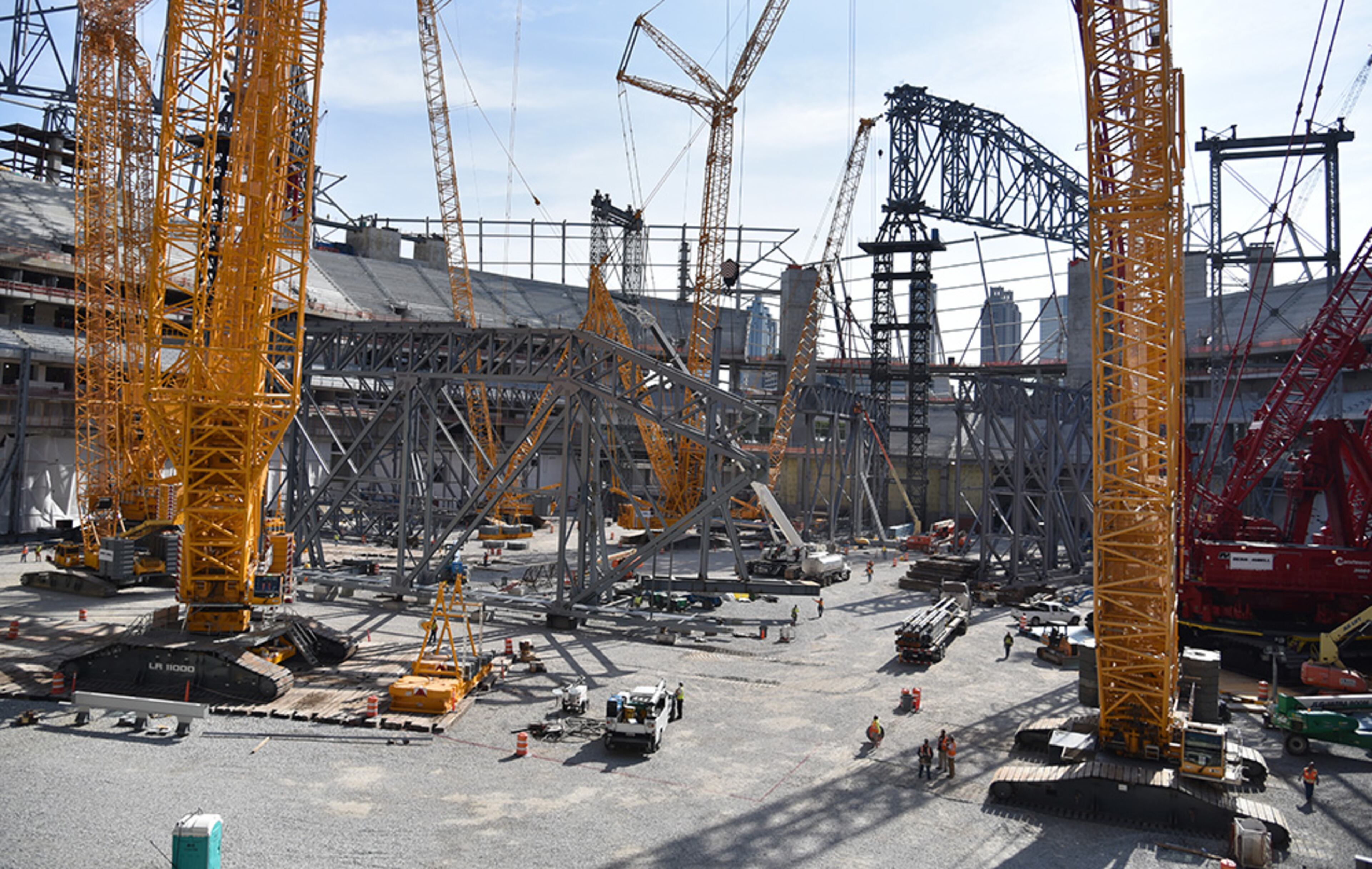 Cranes sit inside the Atlanta Falcons new stadium currently under construction Monday, May 16, 2016, in Atlanta. Falcons will pitch their proposal to host a Super Bowl in Atlanta next week at owners' meetings.