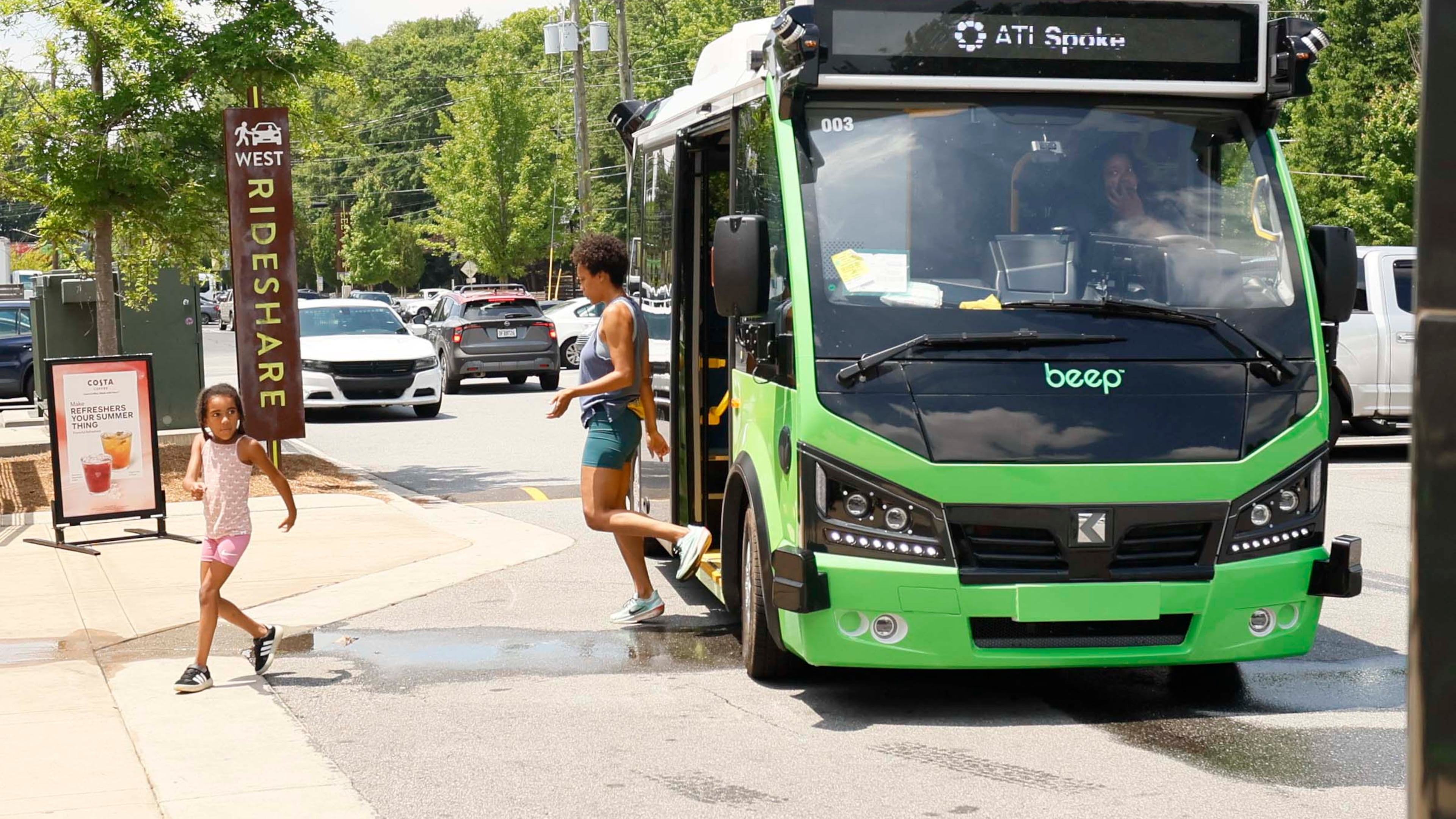 Passengers are seen getting off an ATL Spoke bus as they arrive at the Lee + White District on Monday, June 1, 2026. The ATL Spoke, an autonomous pilot program, began offering service recently. It connects the West End MARTA station and the Lee + White District. It operates seven days a week. (Miguel Martinez/AJC)