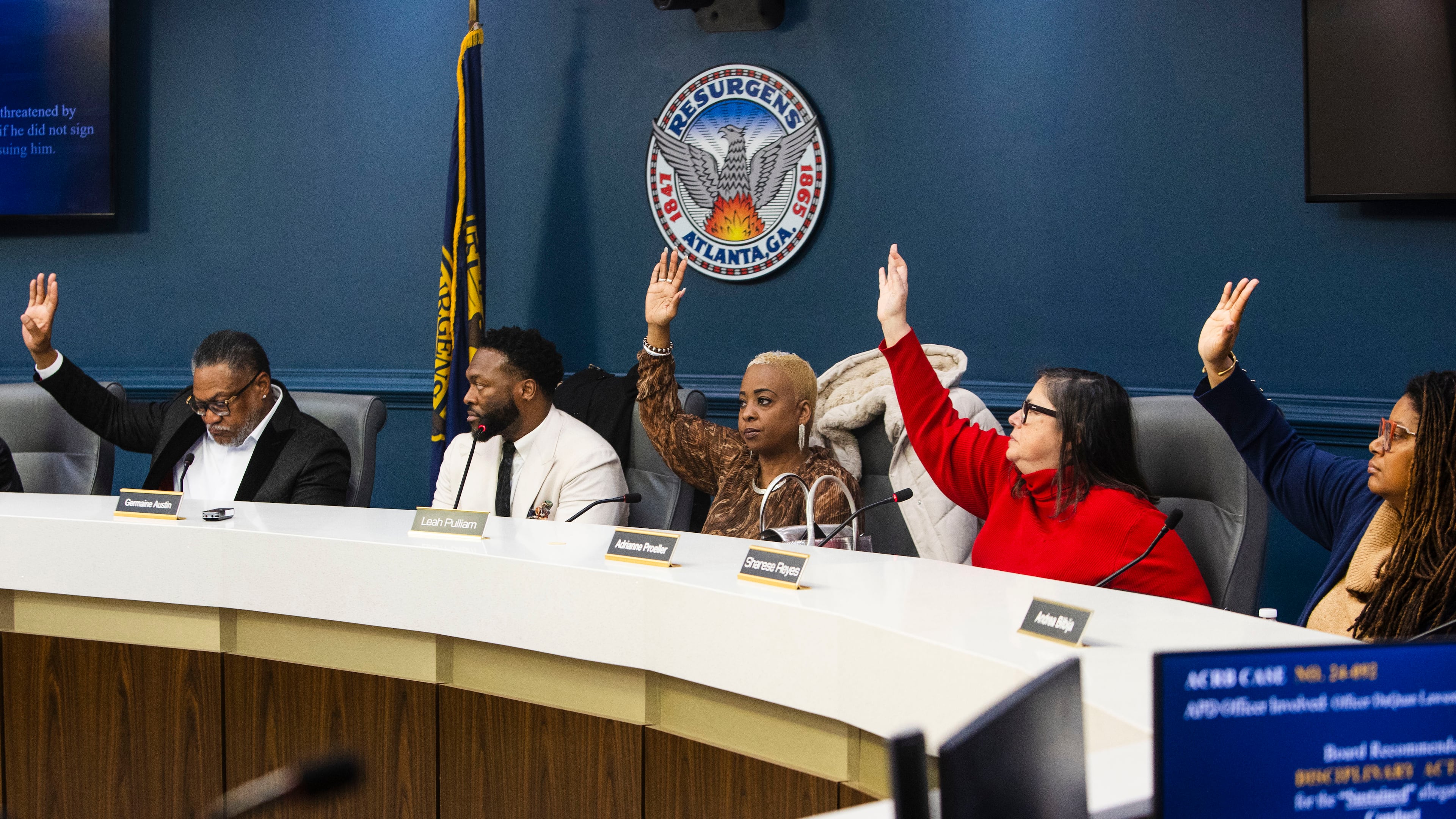 Members of the Atlanta Citizen Review Board vote during a meeting of the Atlanta Citizen Review Board on Thursday, Dec. 12, 2024, at Atlanta City Hall in Atlanta. The Atlanta Citizen Review Board is responsible for investigating officer misconduct including officer-involved shootings and in-custody deaths. CHRISTINA MATACOTTA FOR THE ATLANTA JOURNAL-CONSTITUTION.