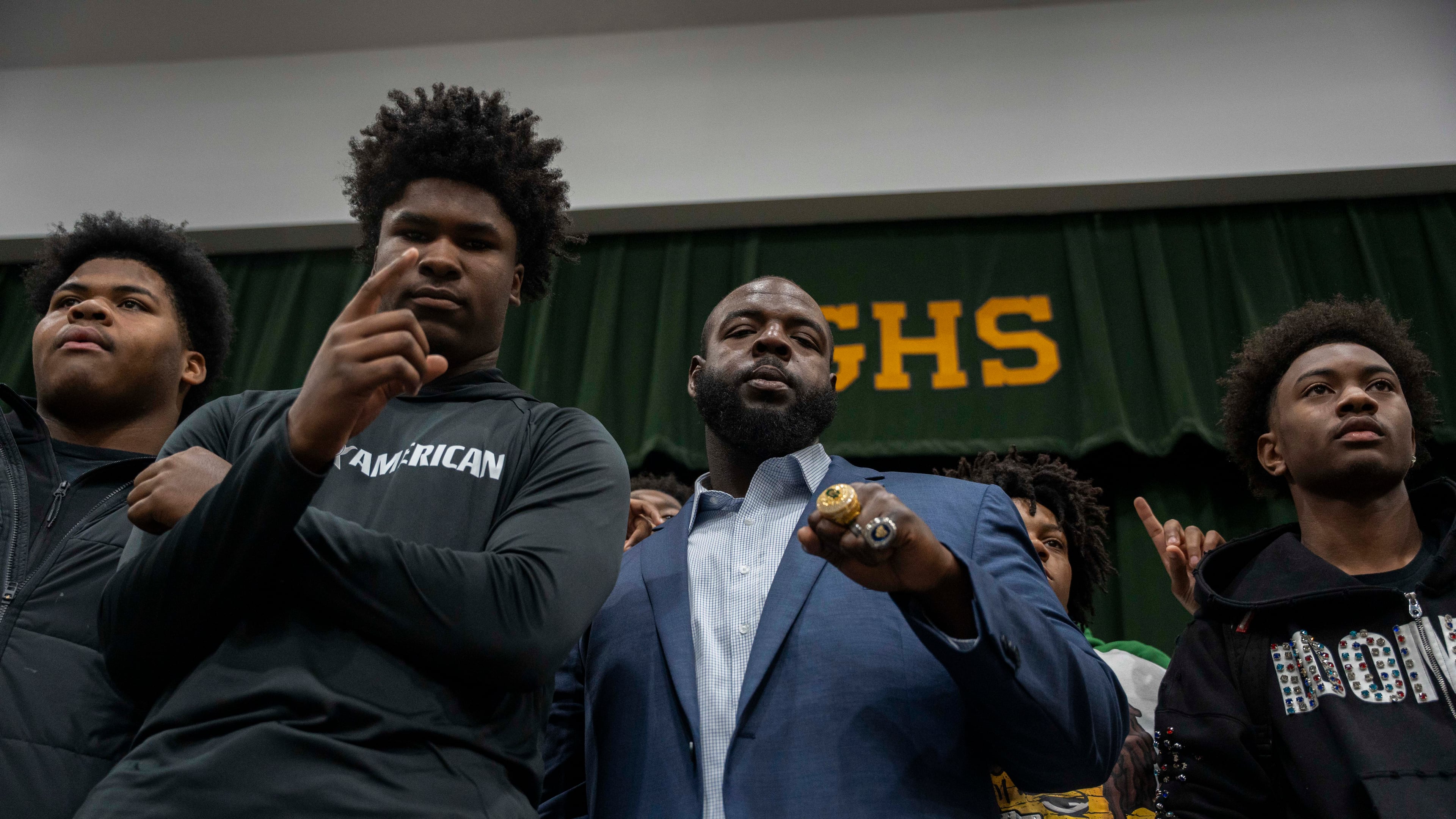 Students at Grayson High School celebrate alongside their new head football coach, Greg Carswell (center), on Wednesday, Jan. 15, 2026. (Olivia Bowdoin for the AJC)