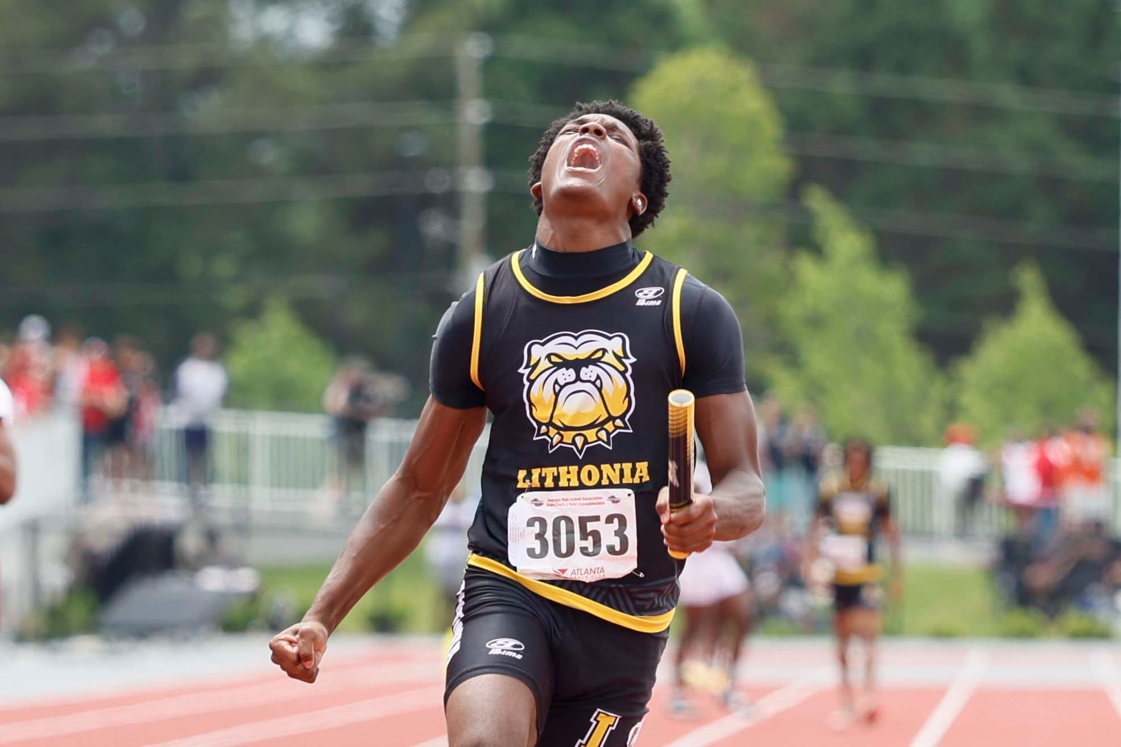 A runner from Lithonia High School reacts after crossing the finish line, helping his team win the Boys 4x100 Meter Relay AAAA during the GHSA track and field state championship at UGA Spec Towns Track on Monday, May 11, 2026, in Athens.
(Miguel Martinez/AJC)