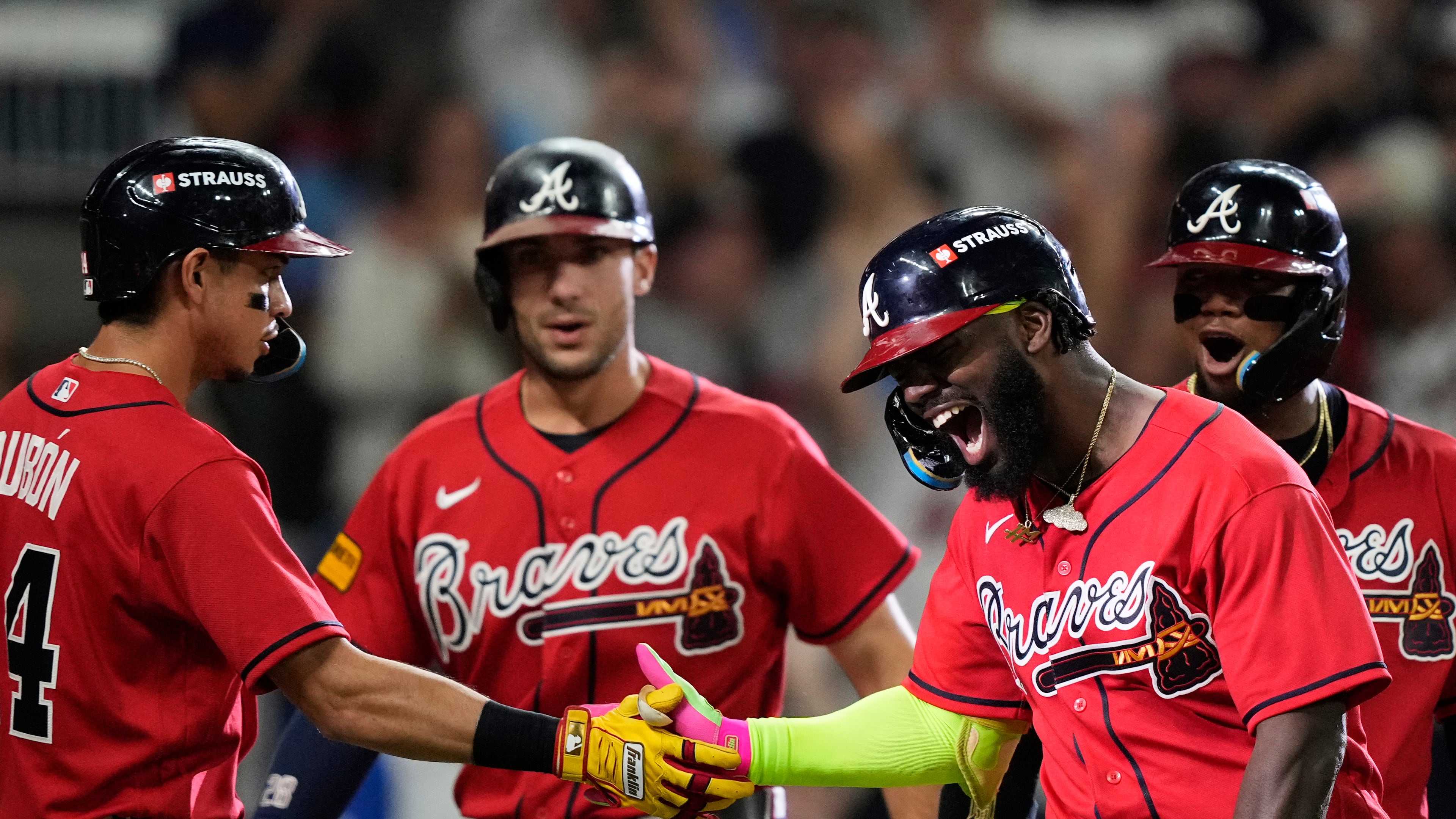 Atlanta Braves' Michael Harris II, third from left, celebrates his three-run home run with Mauricio Dubón (14), Matt Olson, second from left, and Ronald Acuña Jr., right, against the Philadelphia Phillies in the first inning during Game 3 of baseball's NL Wild Card Series, Thursday, Oct. 1, 2026, in Atlanta. (AP Photo/Brynn Anderson)