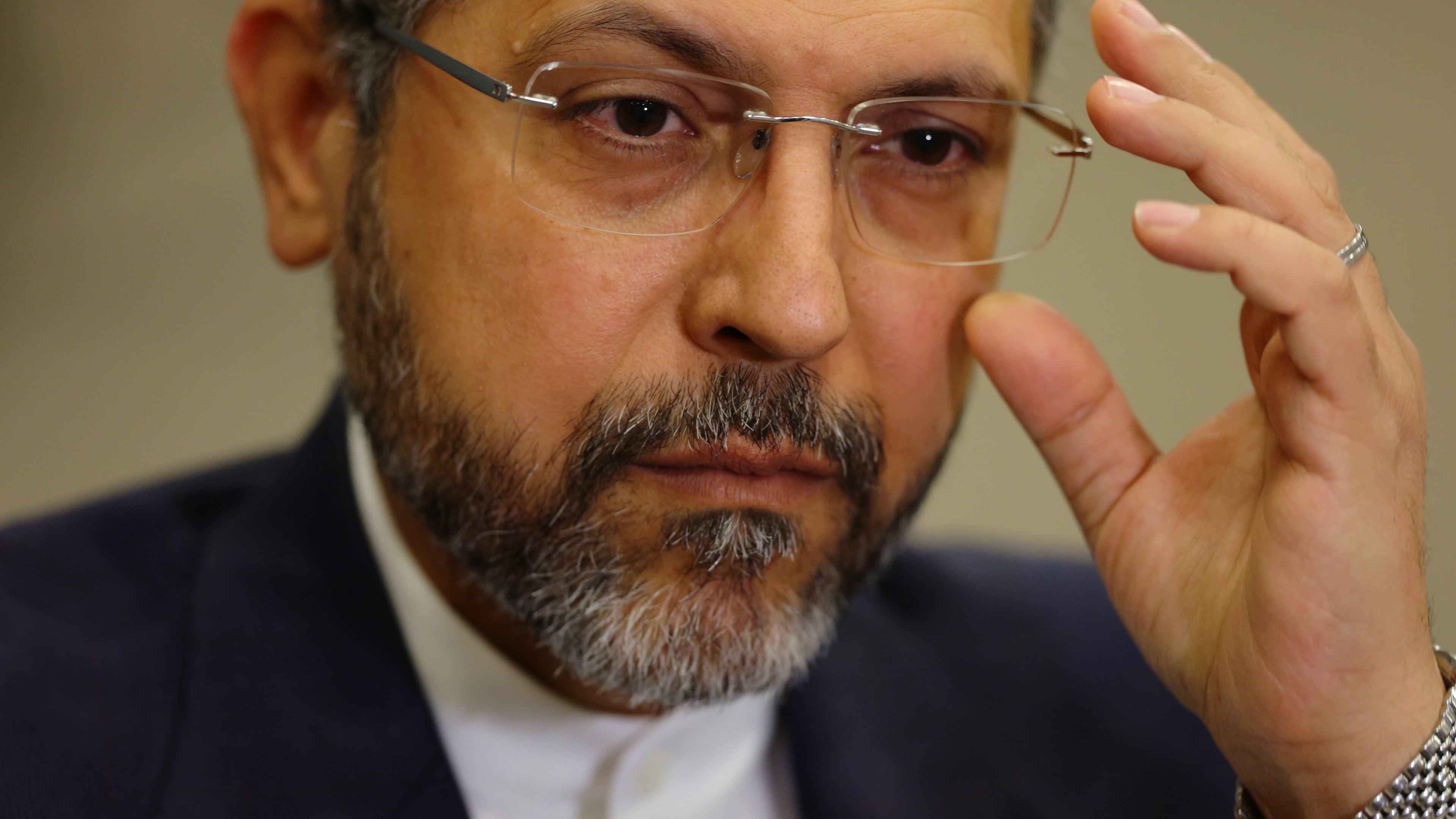Iran's Deputy Foreign Minister Saeed Khatibzadeh adjusts his glasses as he talks during an interview with Associated Press at the Antalya Diplomacy Forum, in Antalya, southern Turkey, Saturday, April 18, 2026. (AP Photo/Riza Ozel)