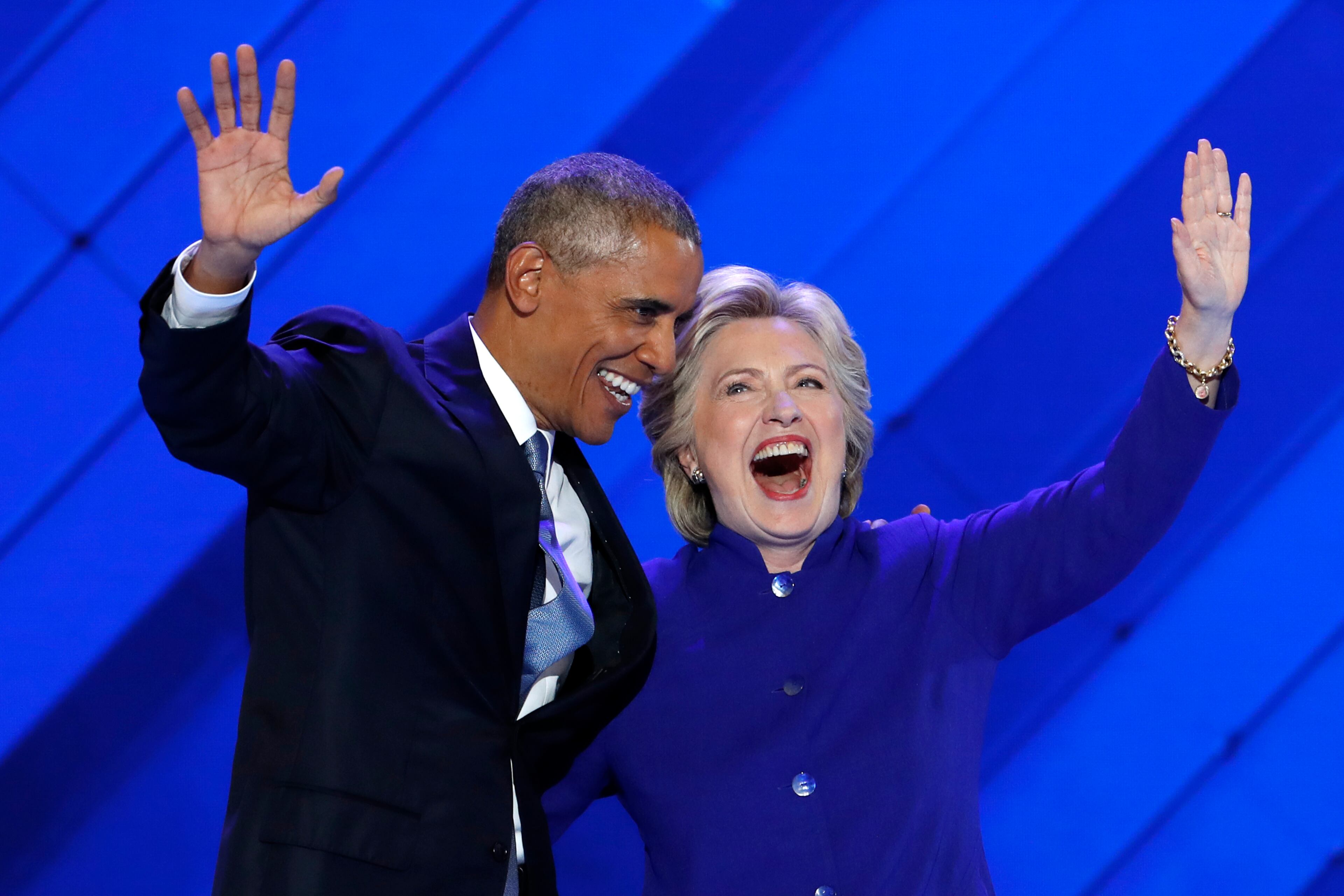 President Barack Obama and Democratic presidential nominee Hillary Clinton wave to delegates after President Obama's speech on Wednesday, July 27, 2016. (AP Photo/J. Scott Applewhite)